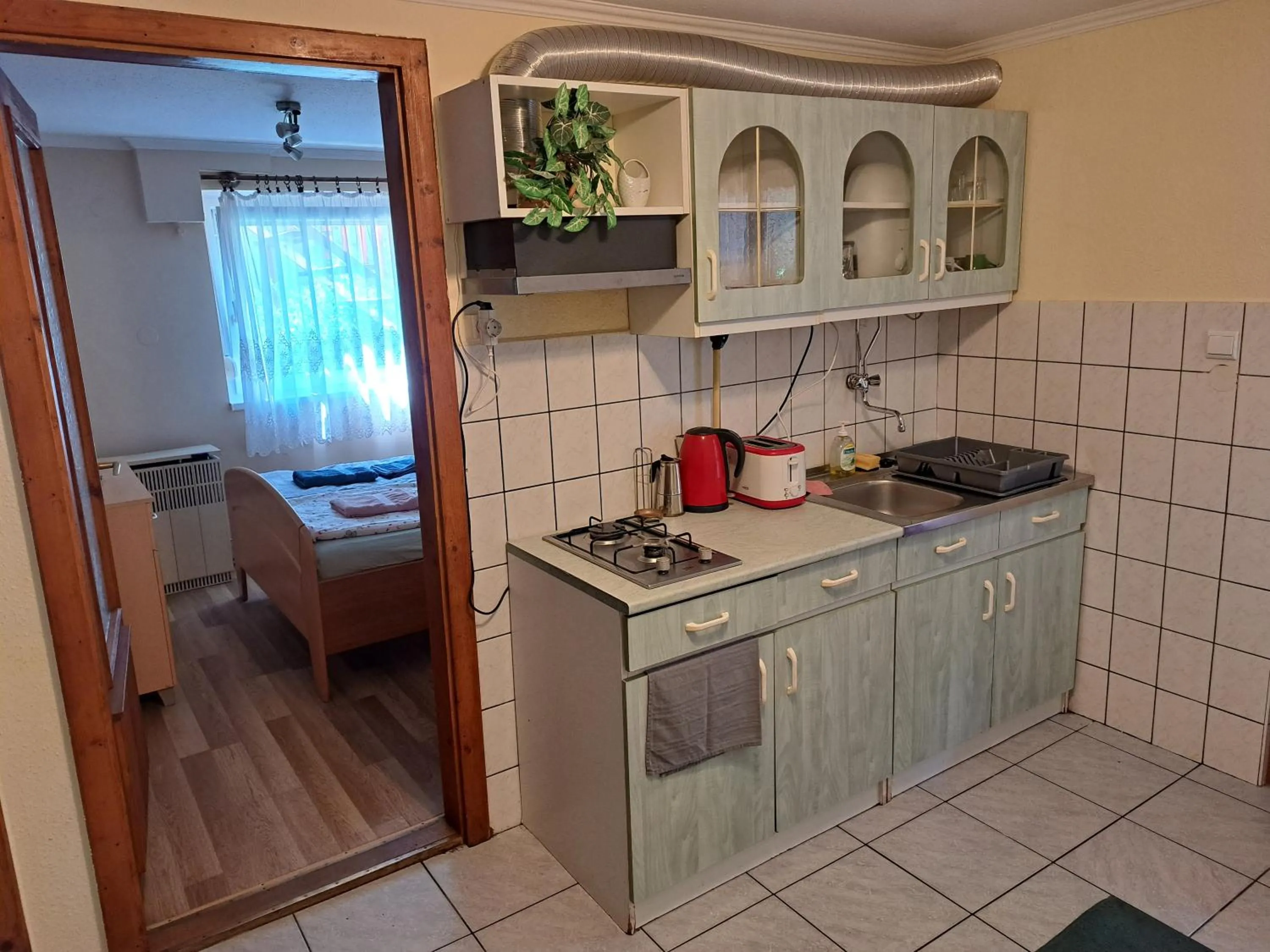 Kitchen or kitchenette in Pink Tulip Apartment House