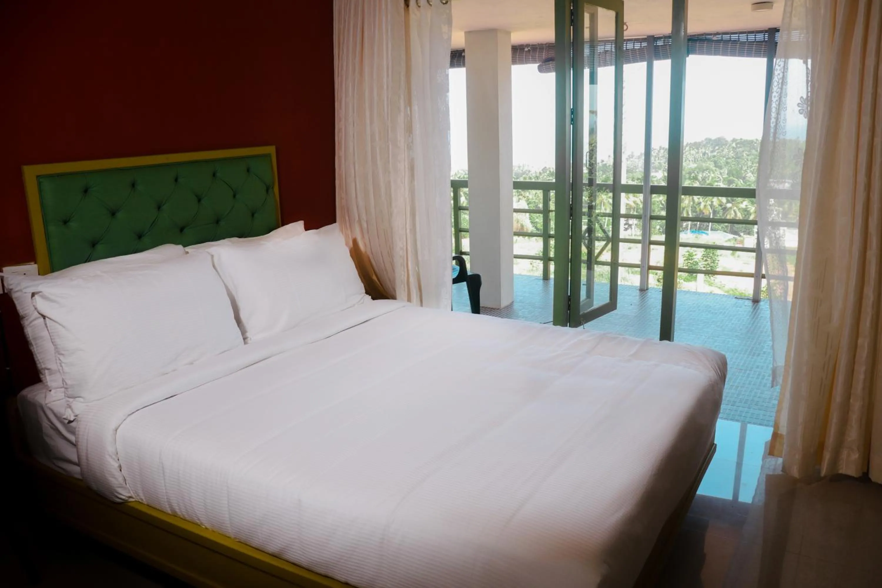 Photo of the whole room, Bed in Aanandakosha Ayurveda Retreat