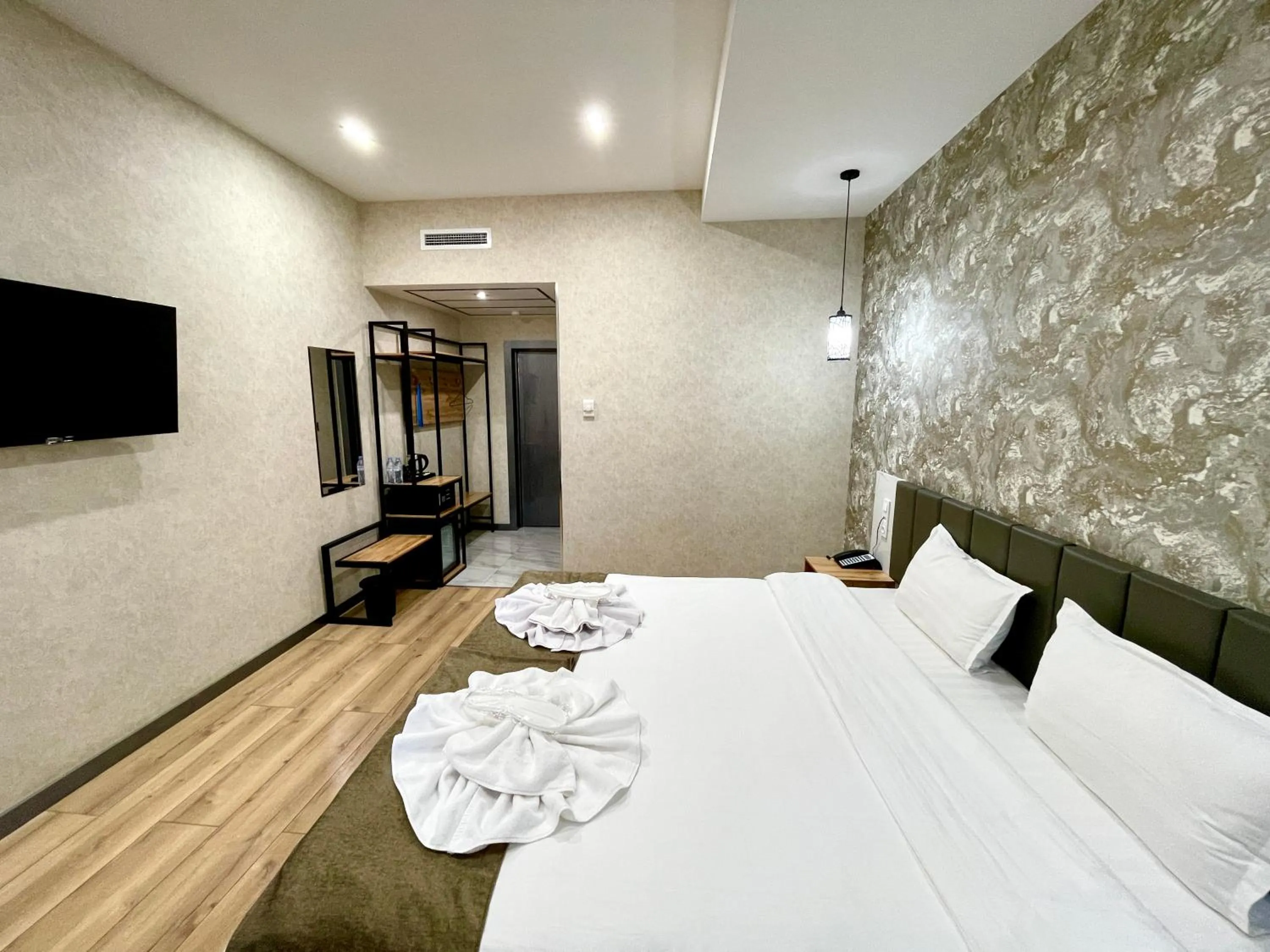 Bed in Alpha Plaza Hotel & SPA
