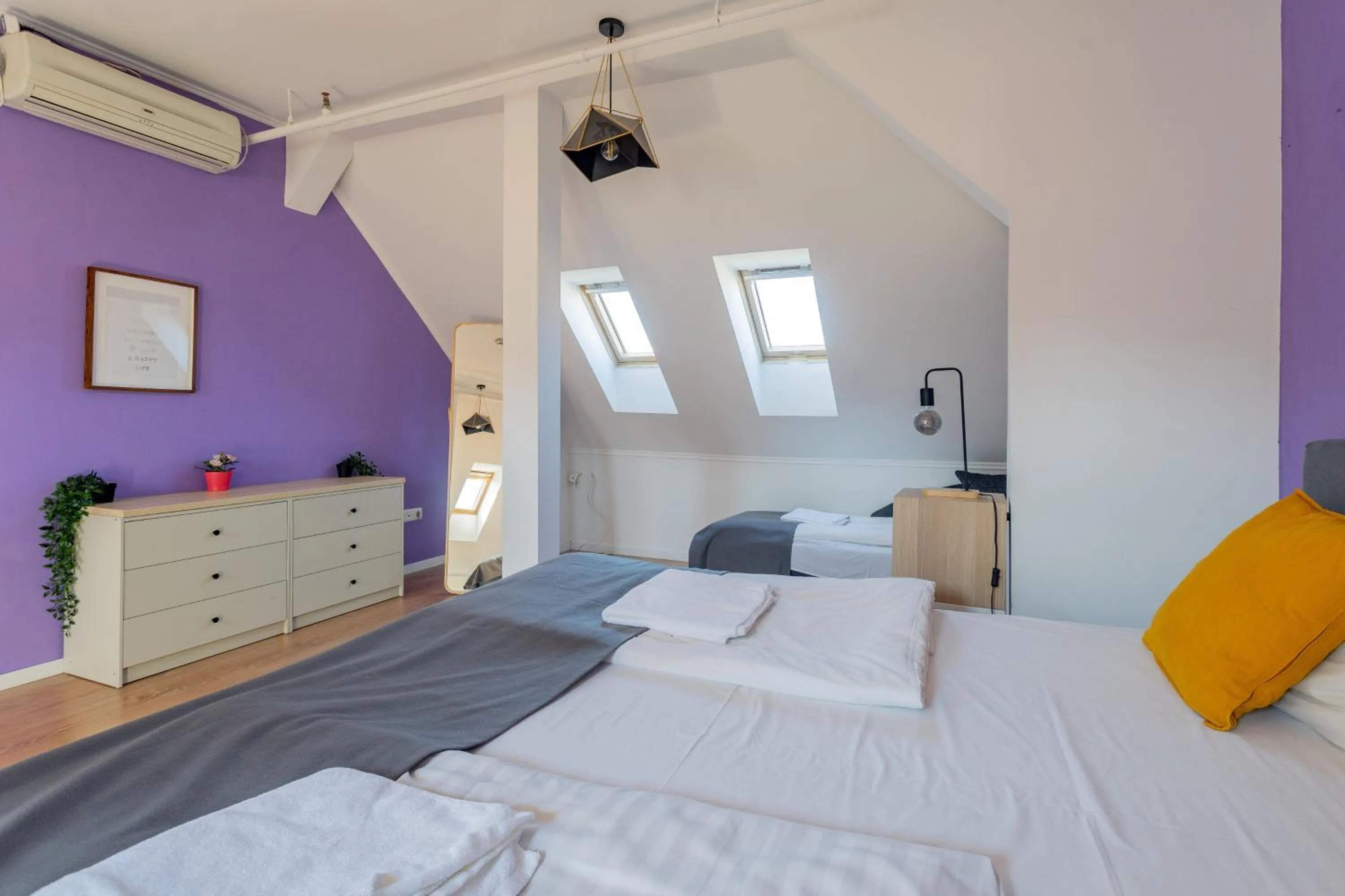 Bed in Triple M Hotel