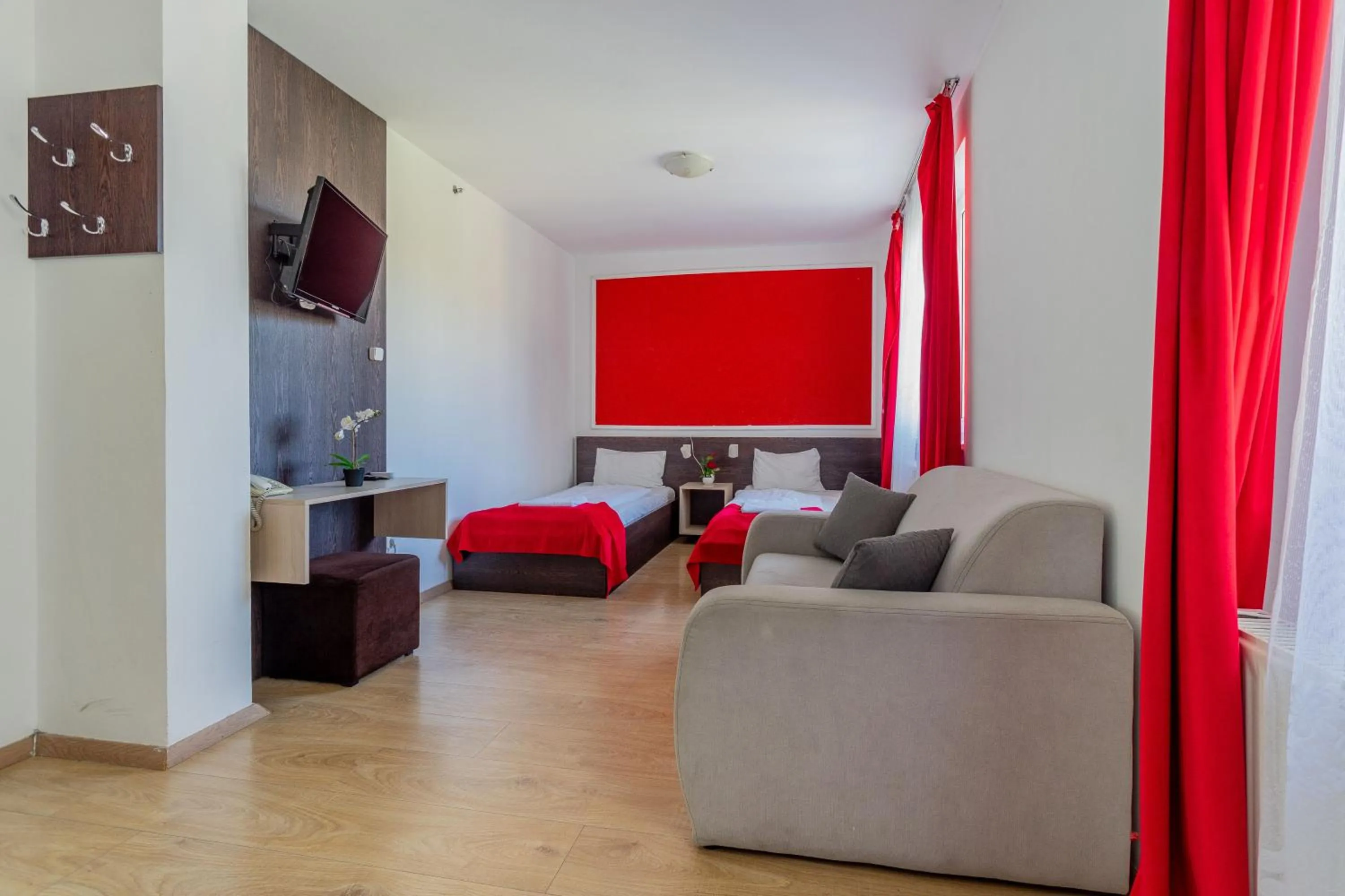 Bed in Triple M Hotel