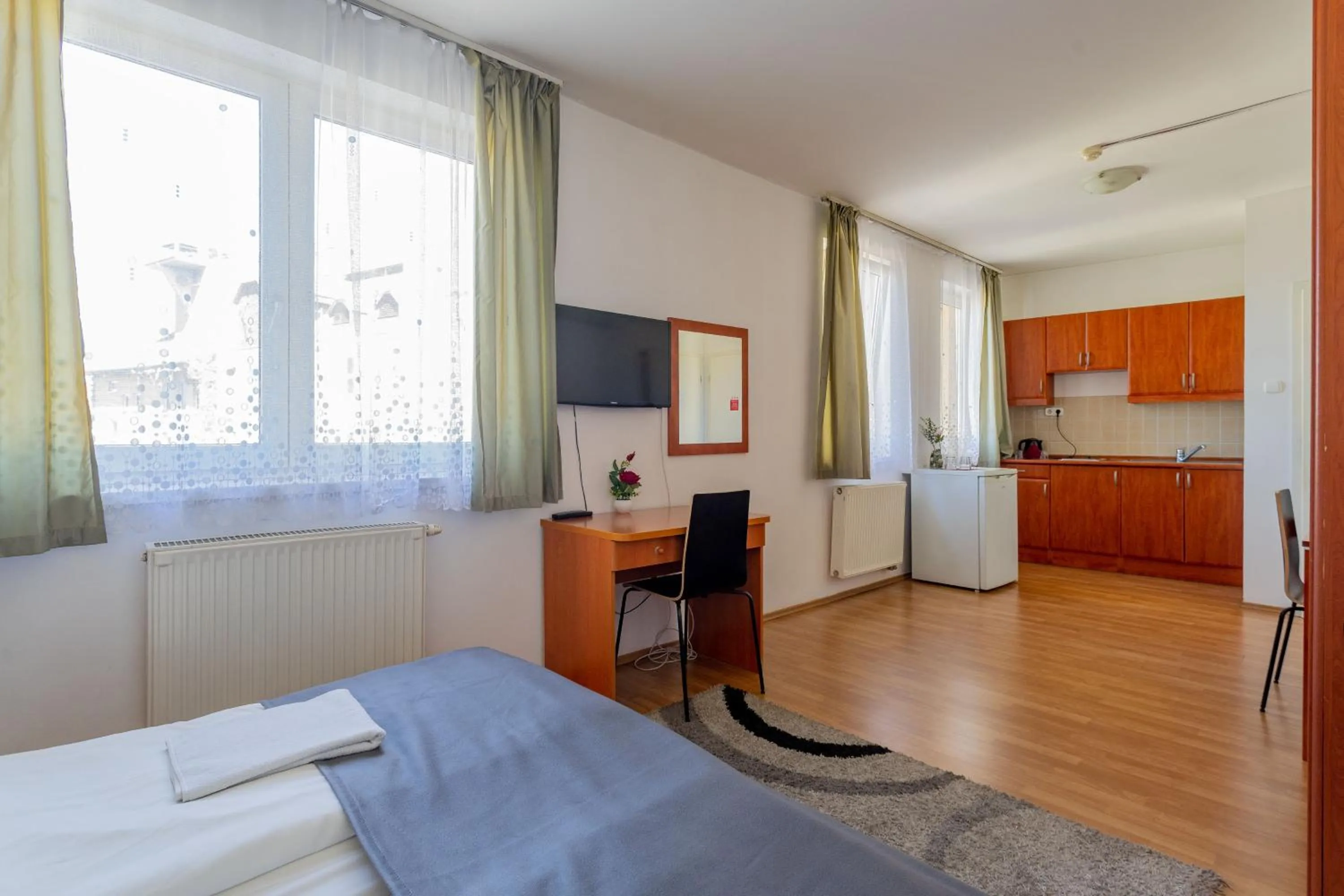 Bed in Triple M Hotel