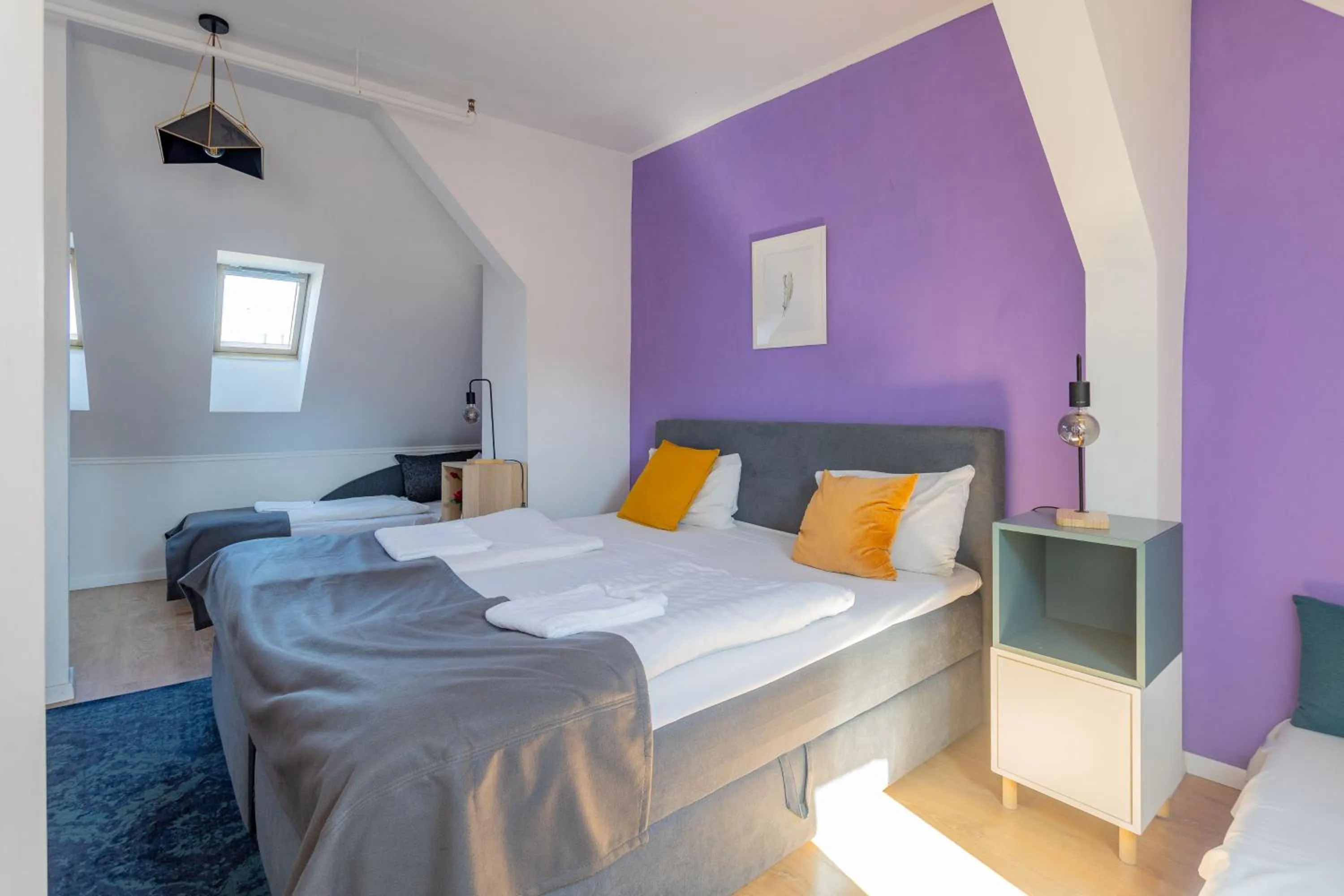 Bed in Triple M Hotel