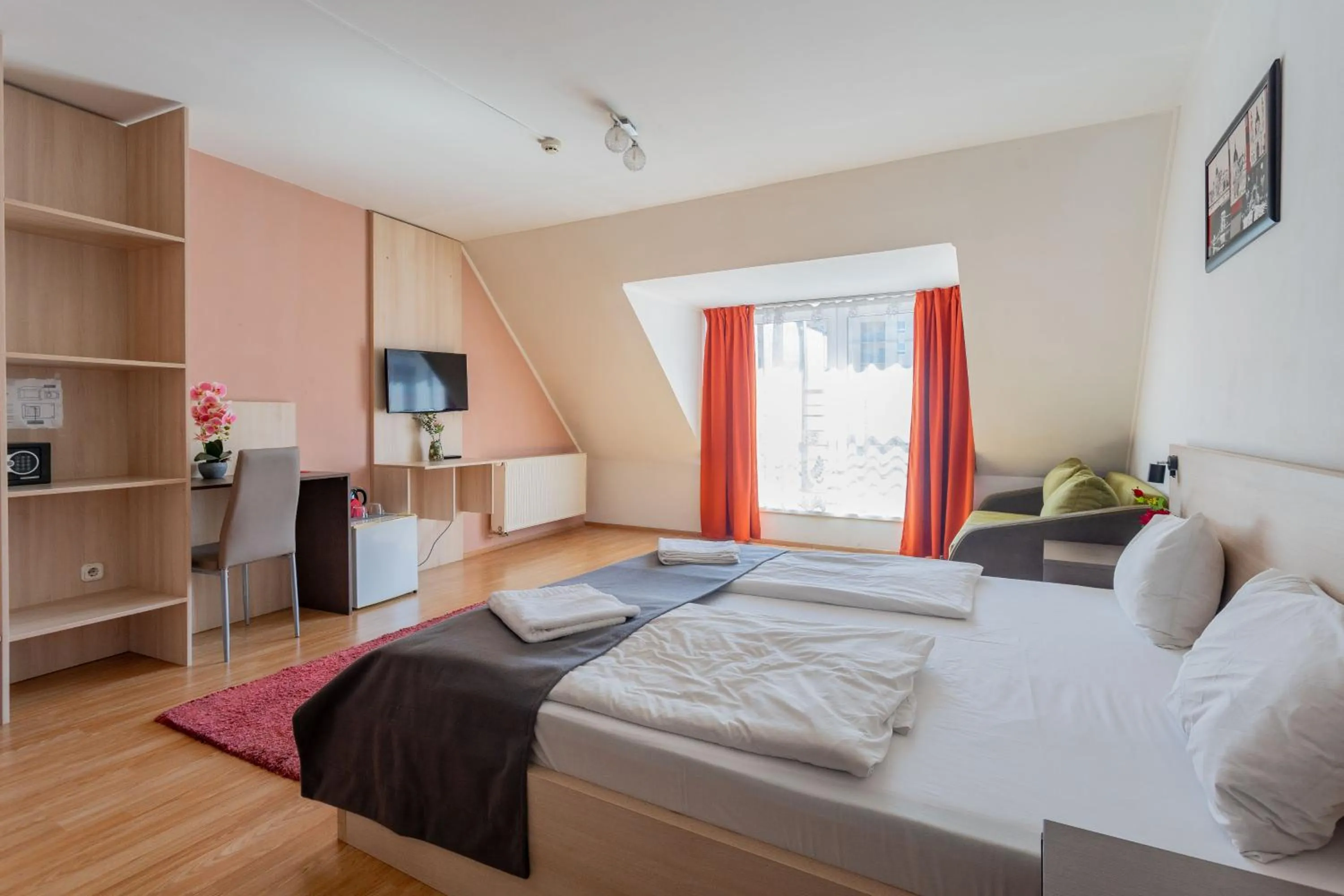 Bed in Triple M Hotel