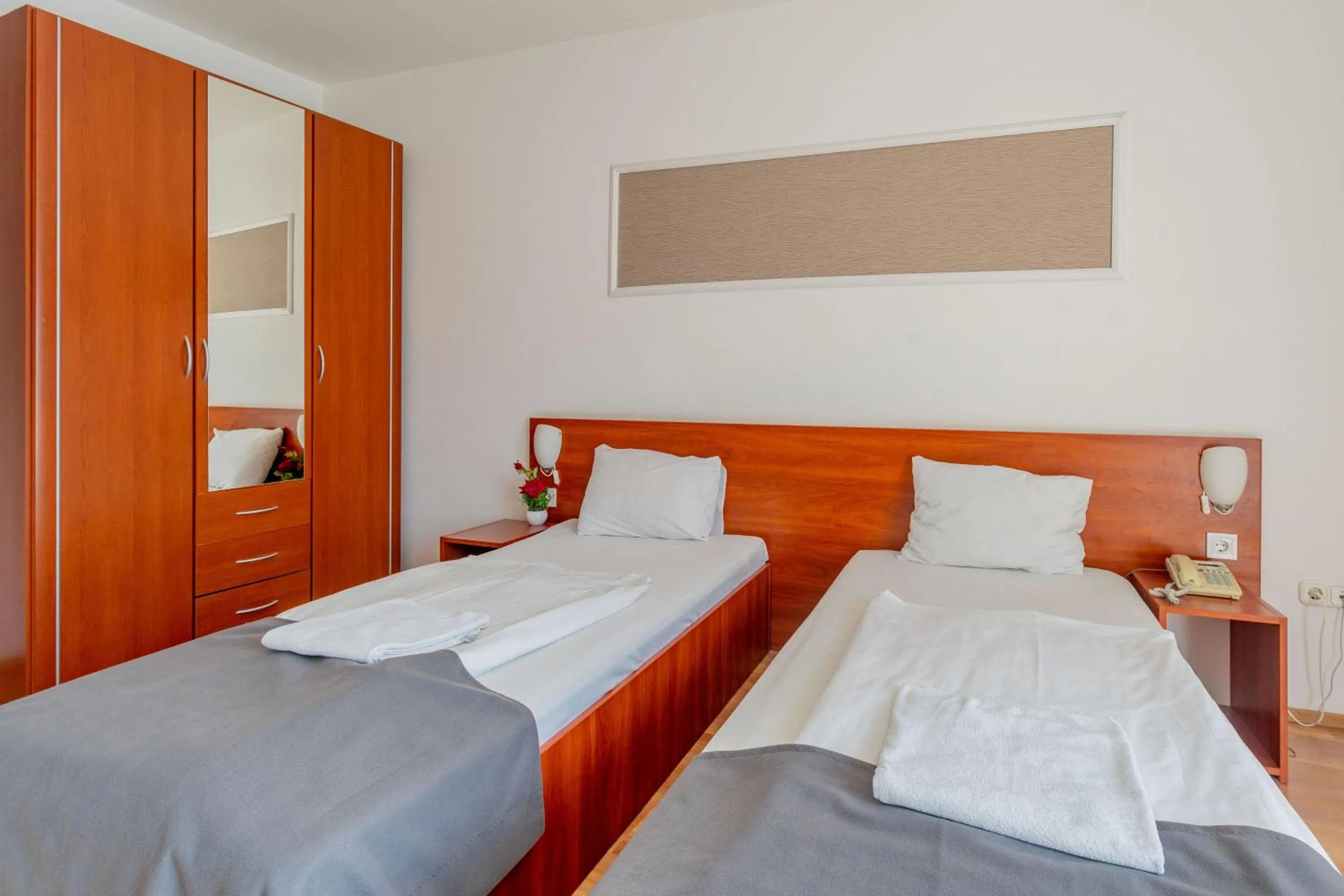 Bed in Triple M Hotel