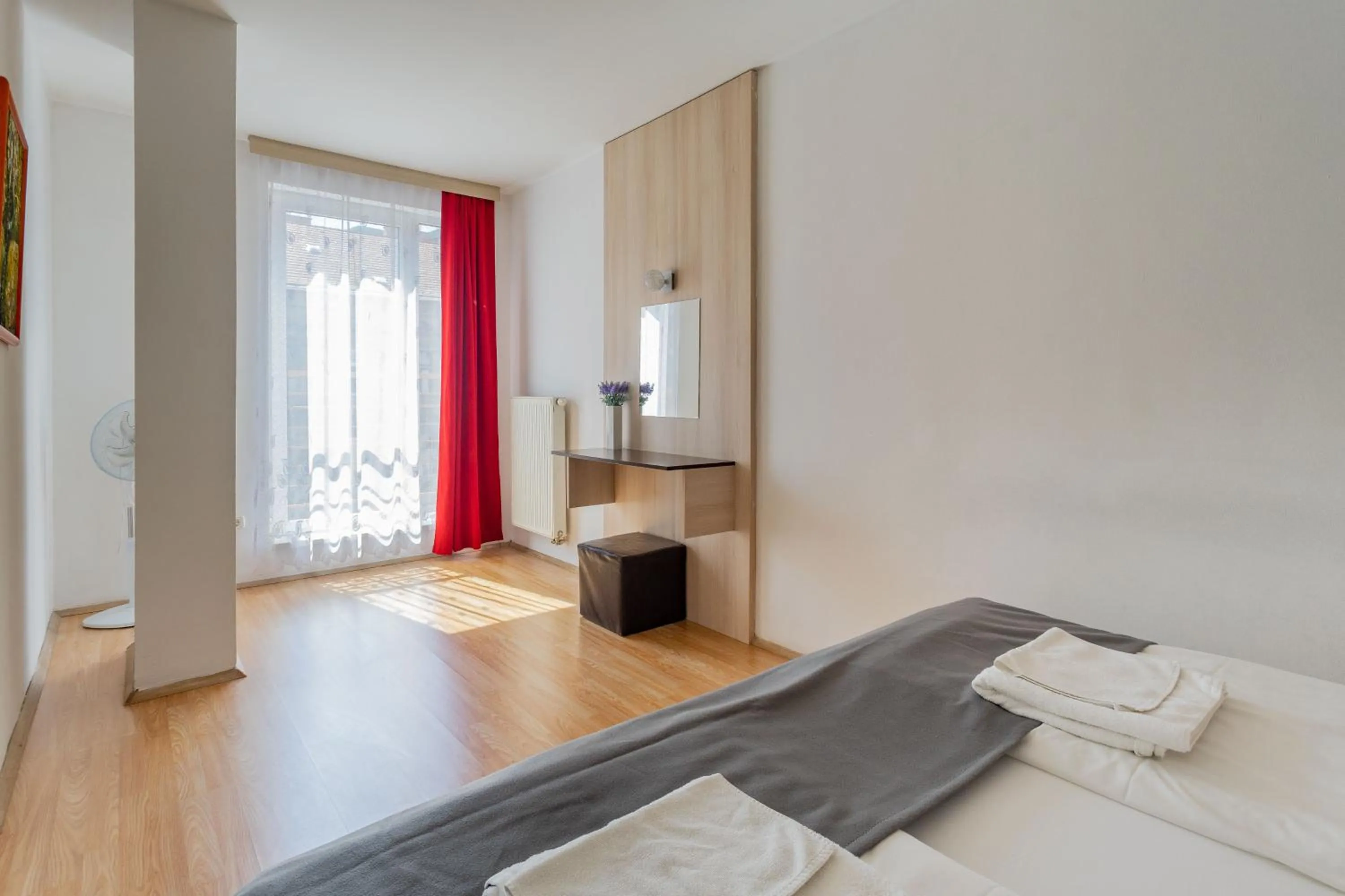 Bed in Triple M Hotel