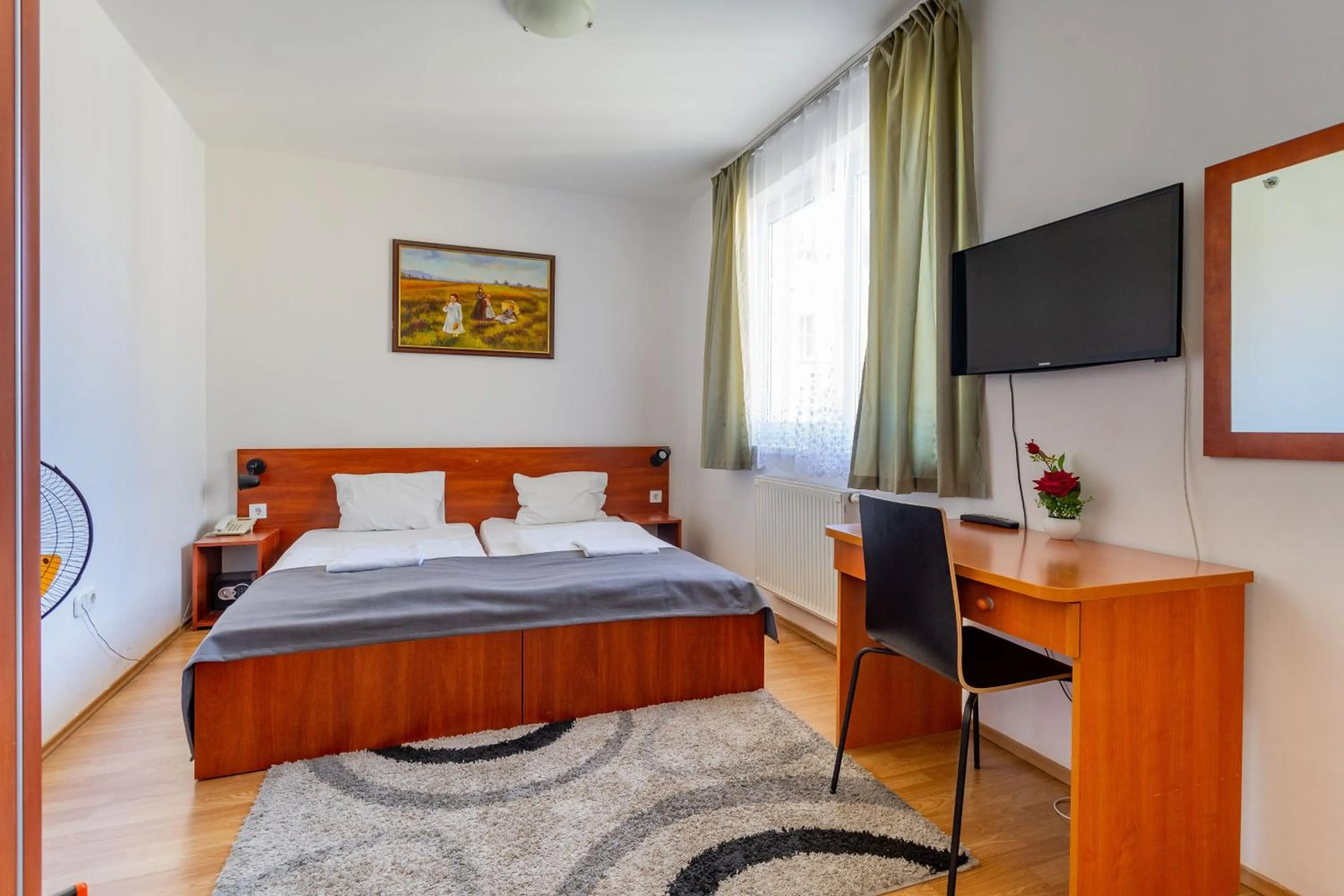 Bed in Triple M Hotel