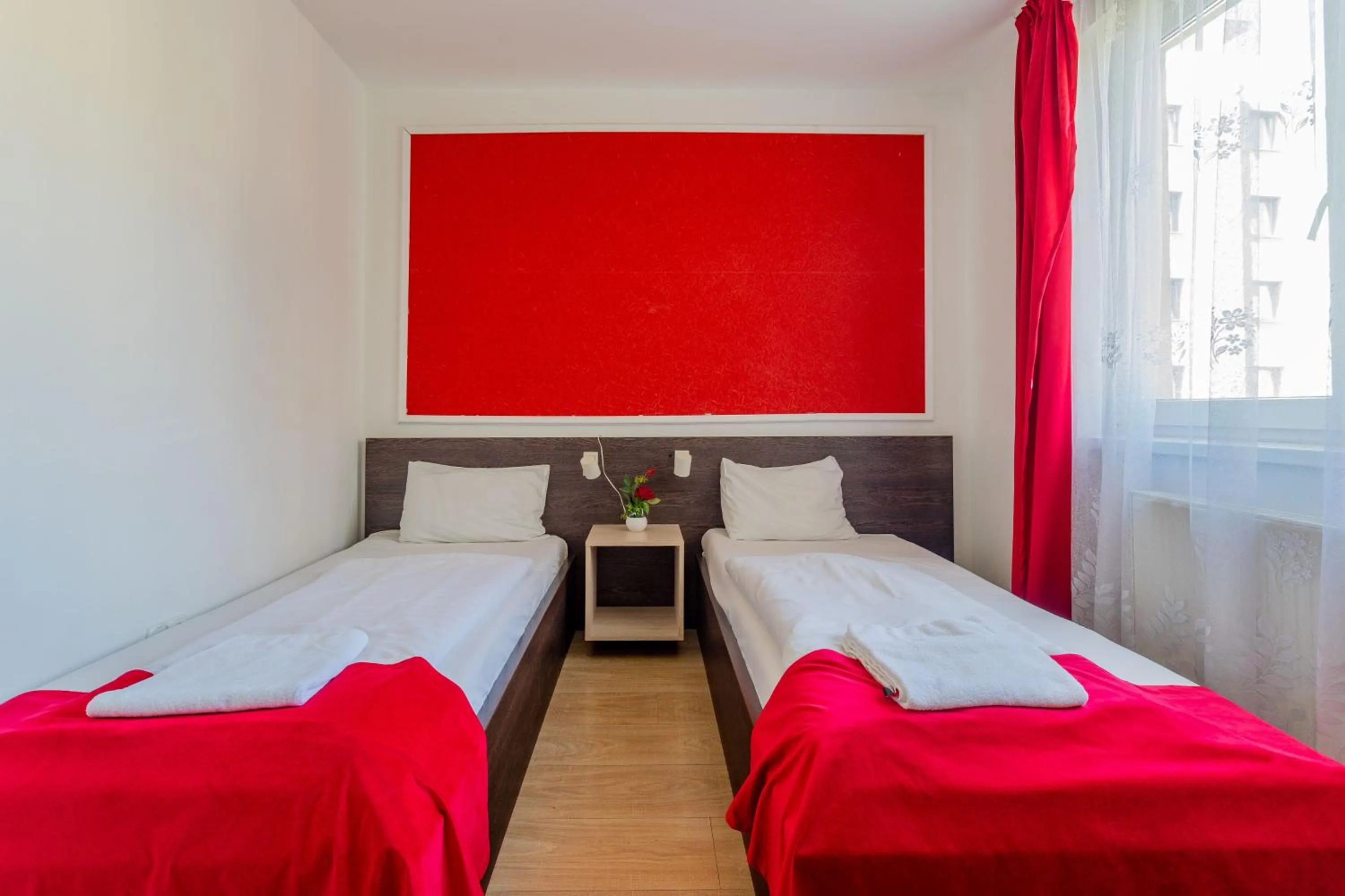 Bed in Triple M Hotel