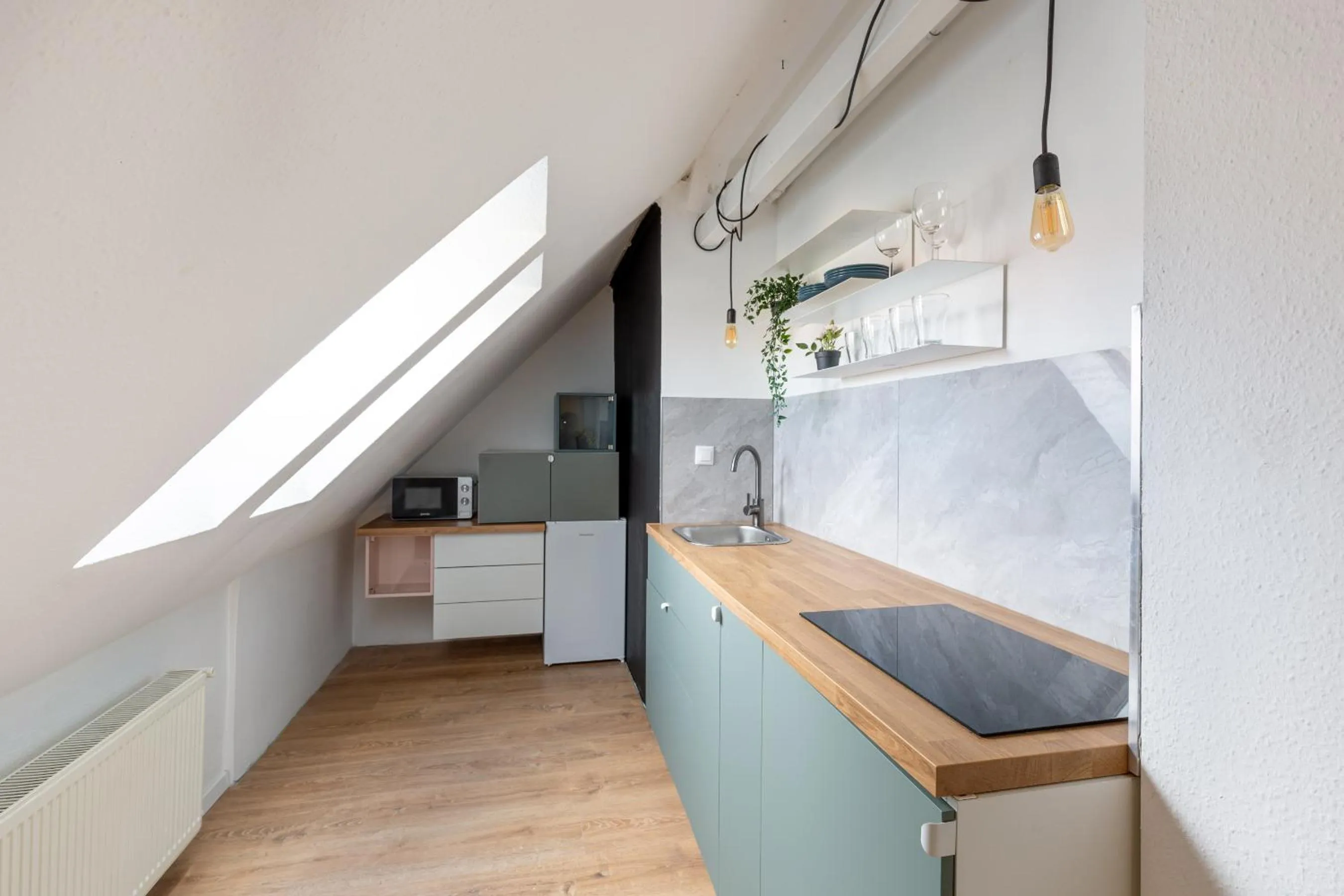 Kitchen or kitchenette in Triple M Hotel