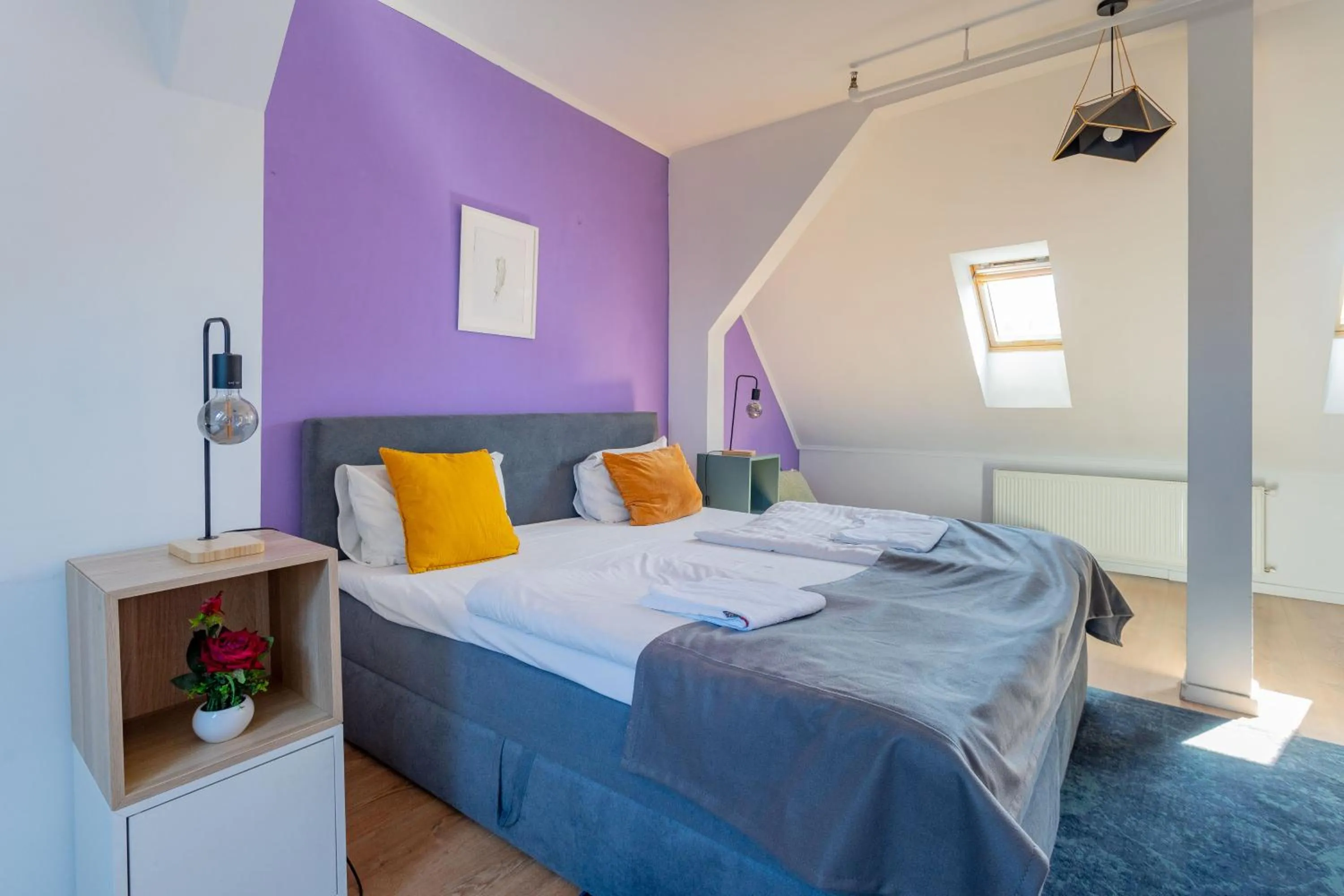 Bed in Triple M Hotel