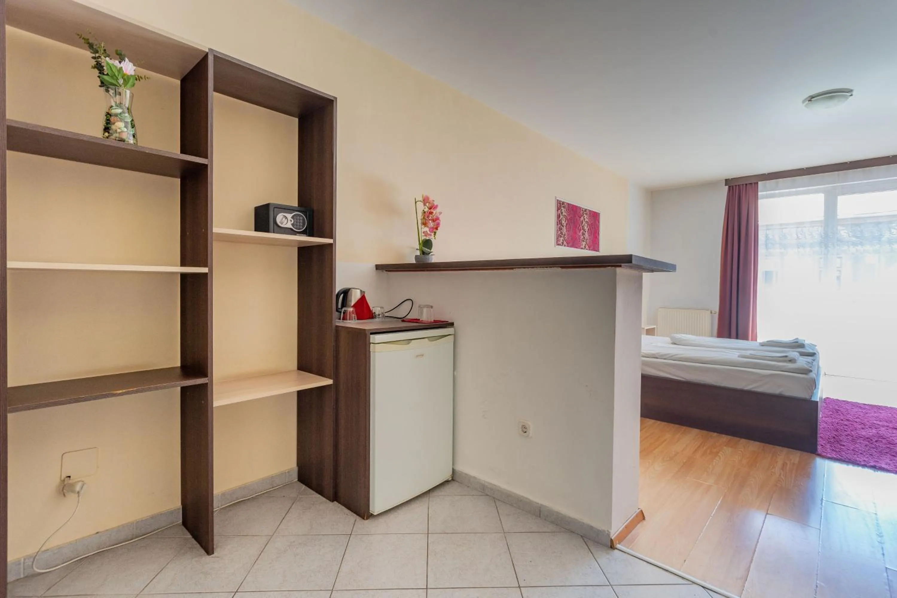 Bed in Triple M Hotel