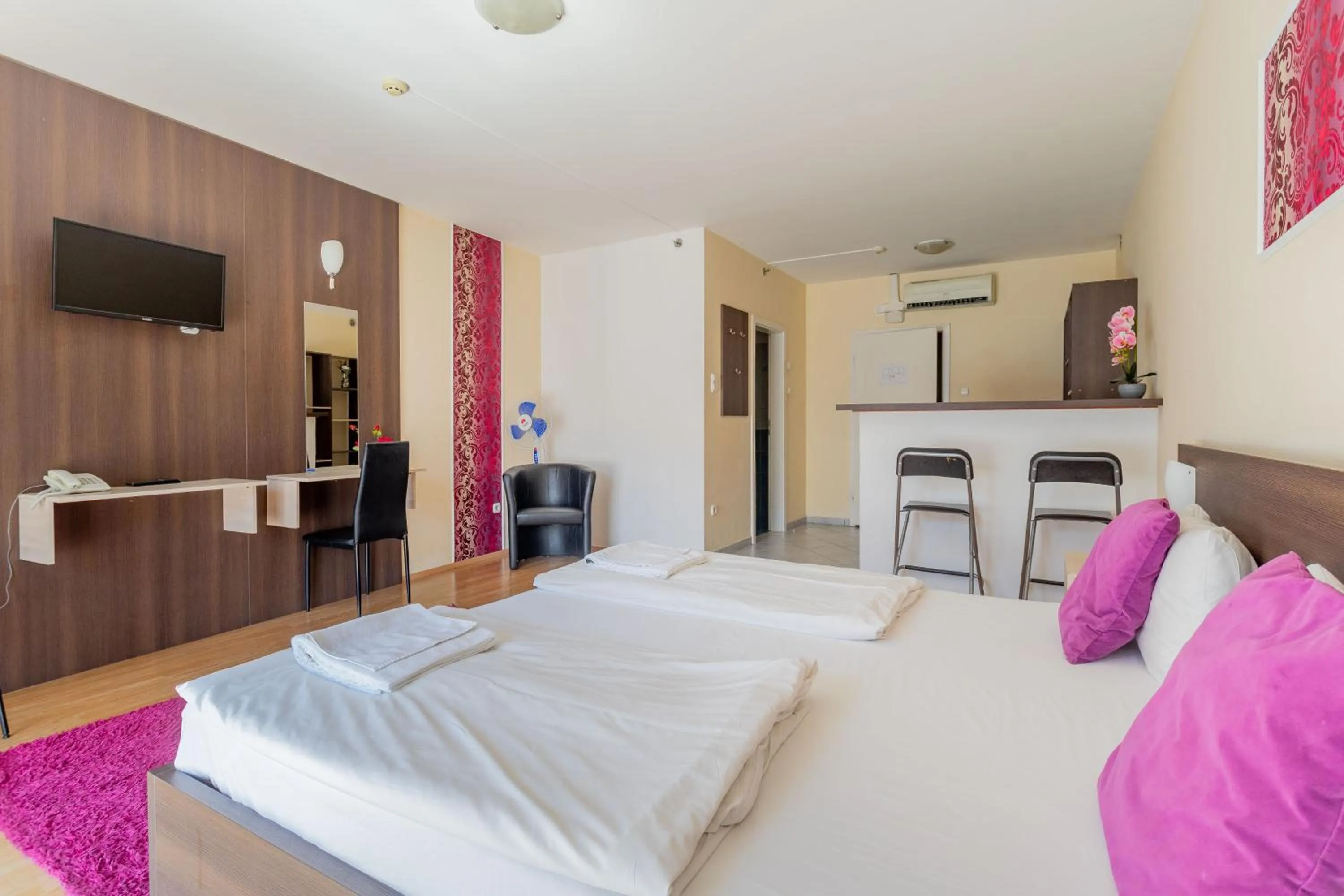 Bed in Triple M Hotel