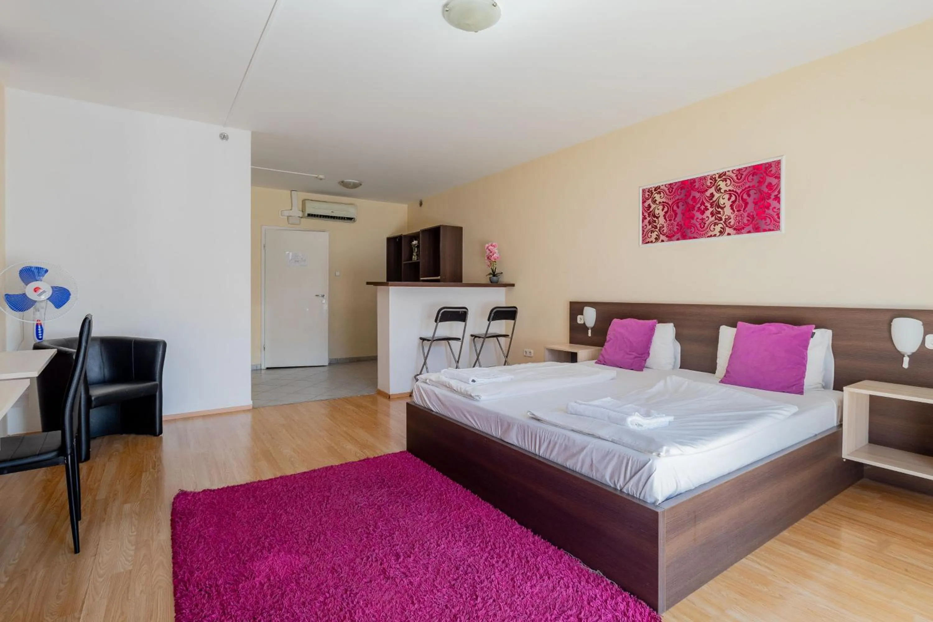 Bed in Triple M Hotel