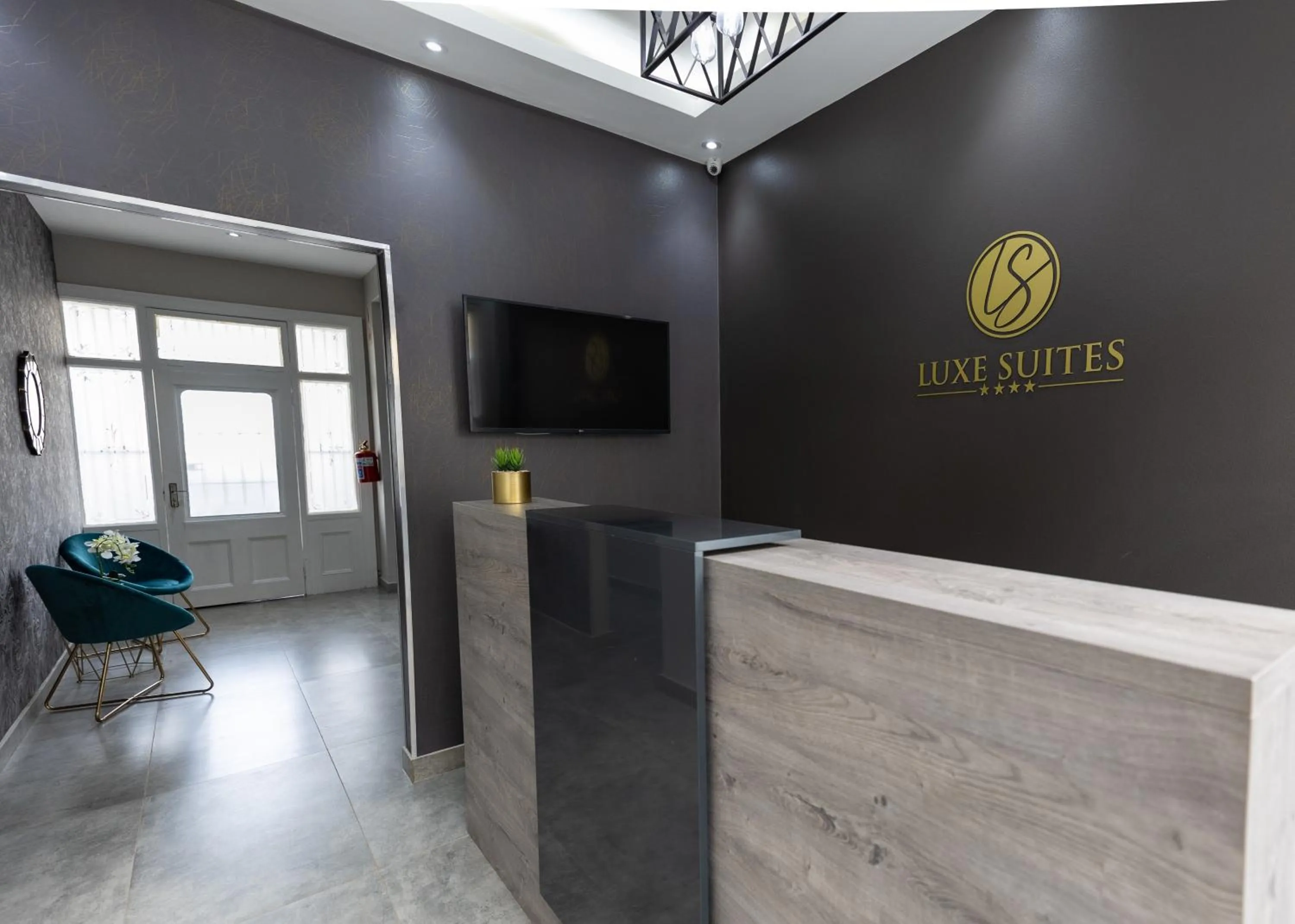Lobby or reception in Luxe Suites Boutique Hotel
