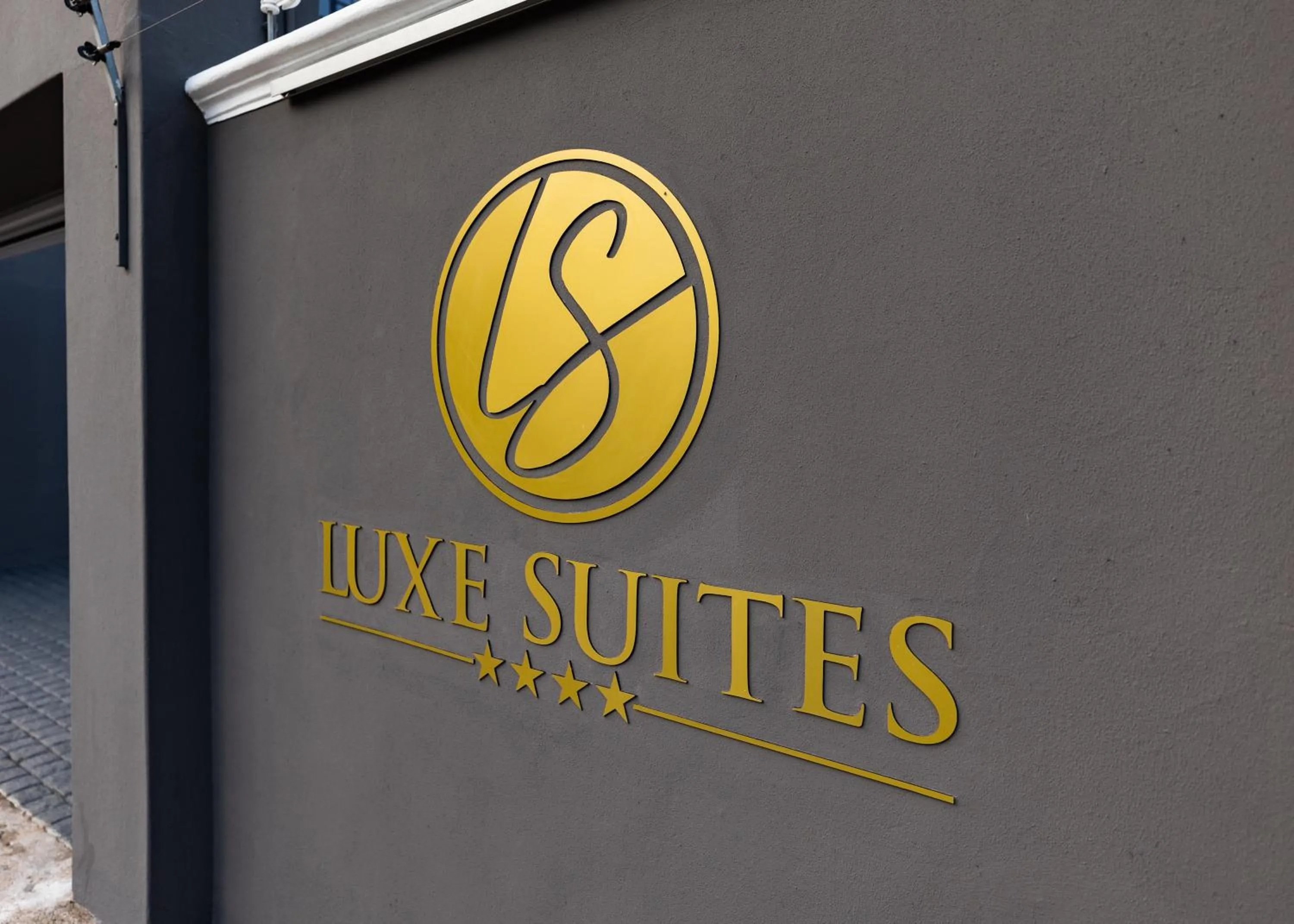 Logo/Certificate/Sign in Luxe Suites Boutique Hotel