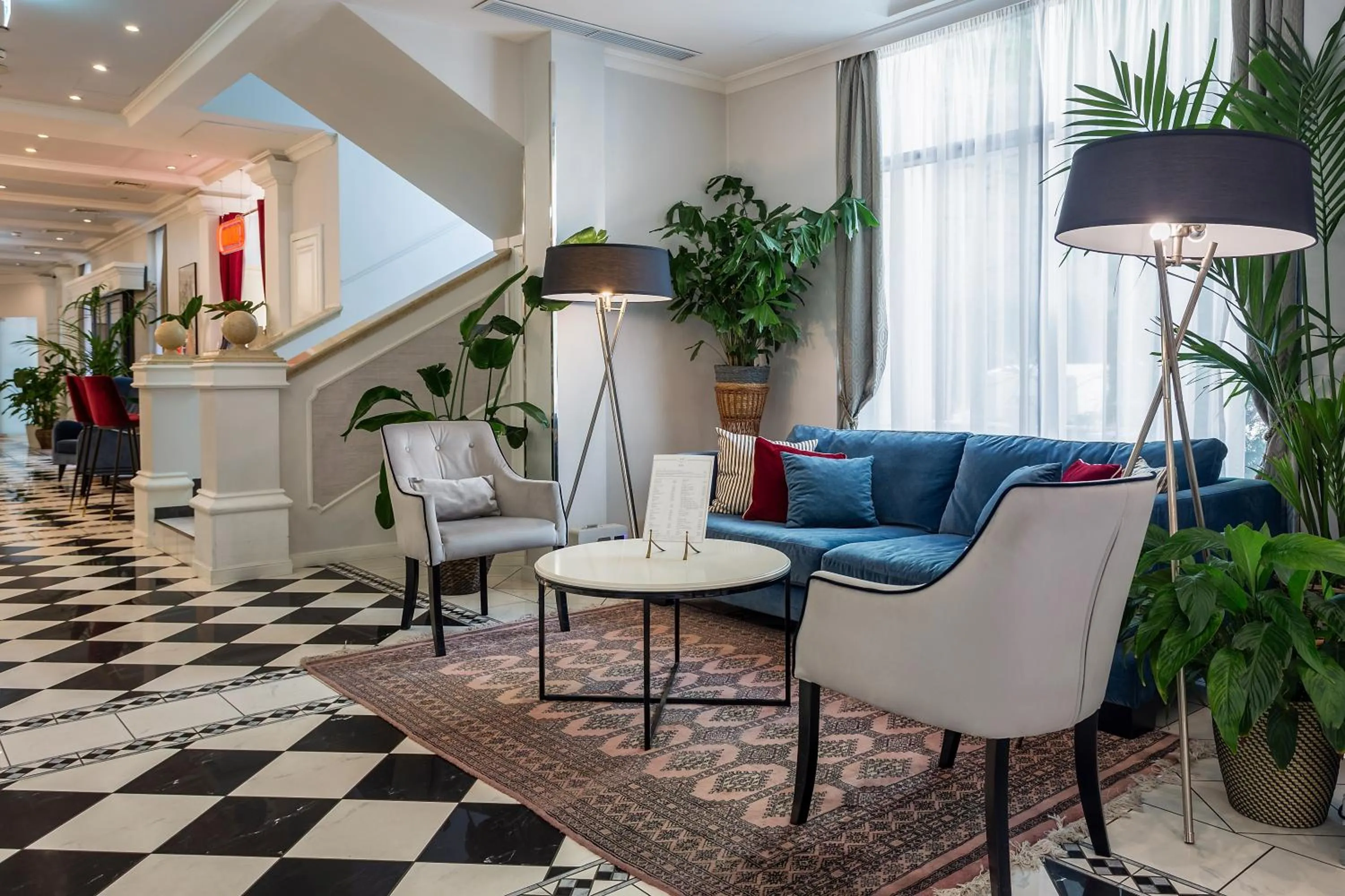 Lobby or reception in Queen's Court Hotel & Residence