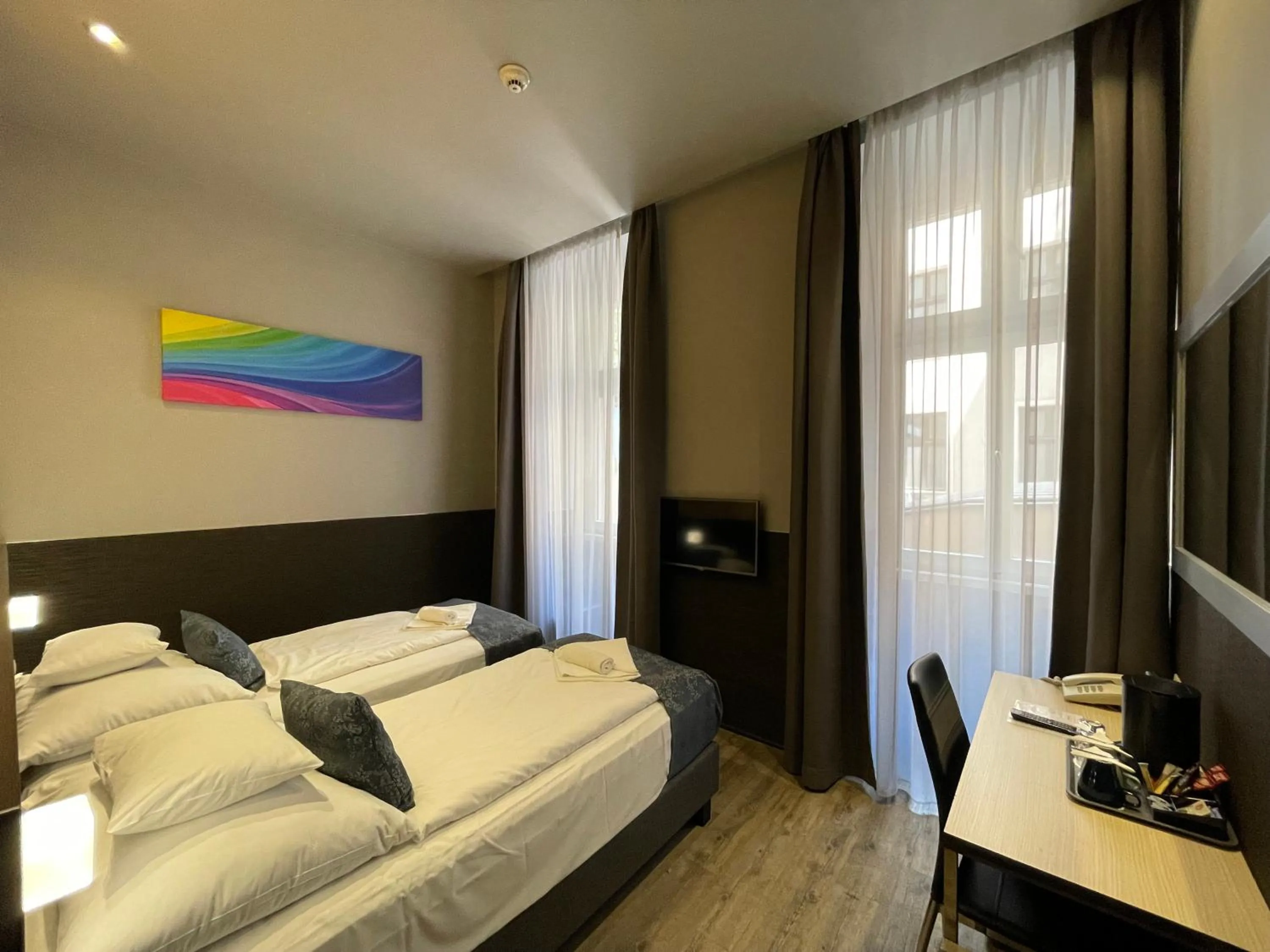 Bed in Carat Boutique Hotel