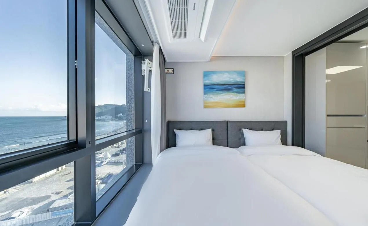 Bed in Songjeong Blue Castle Hotel