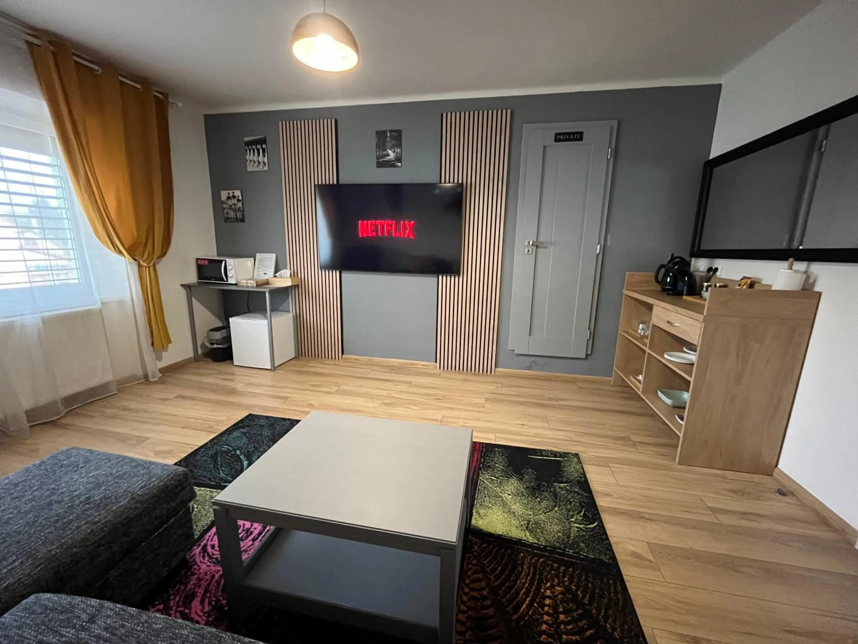 Communal lounge/ TV room in APARTMENTS TRENČÍN -Free Parking-