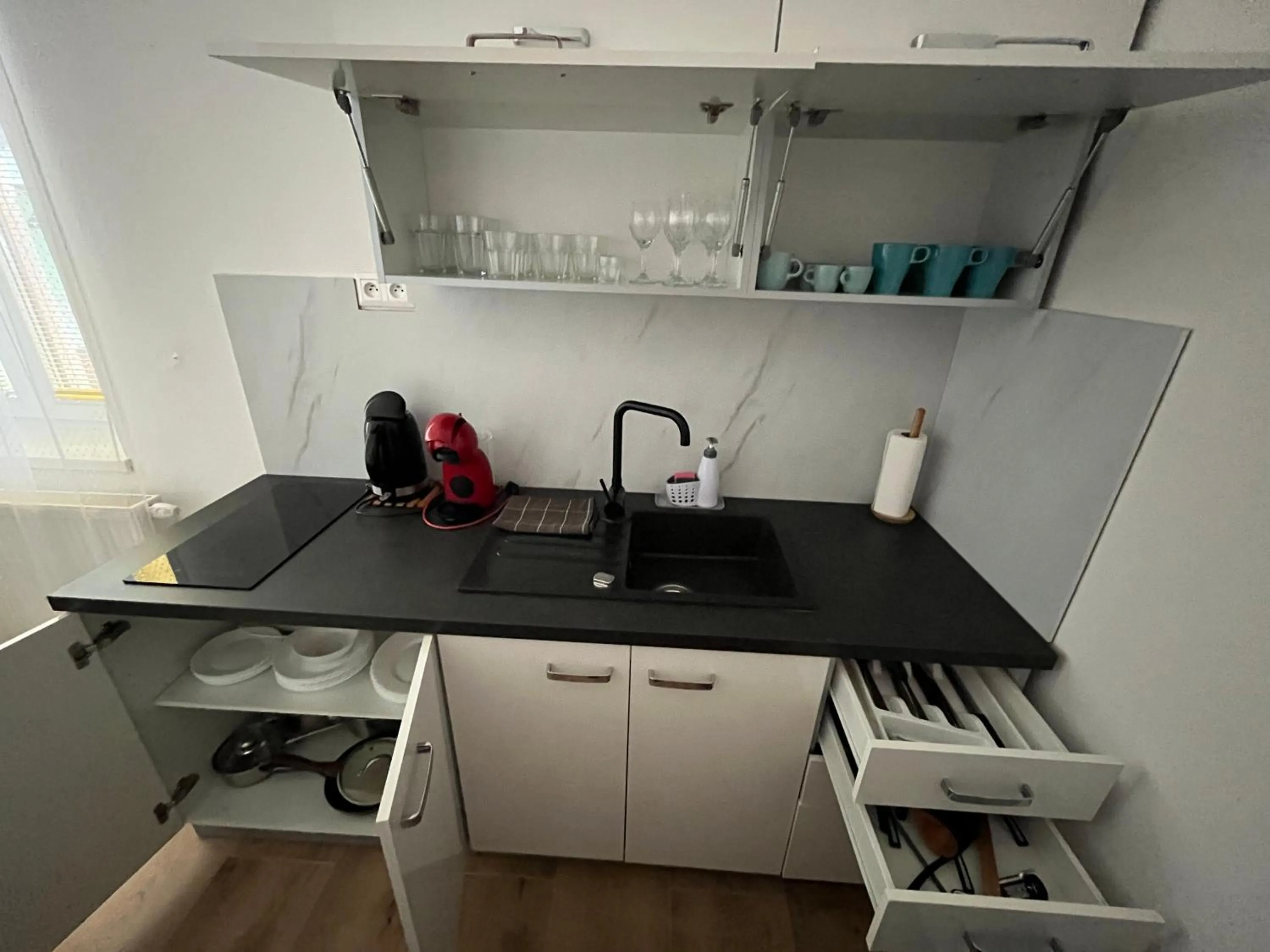Kitchen or kitchenette in APARTMENTS TRENČÍN -Free Parking-