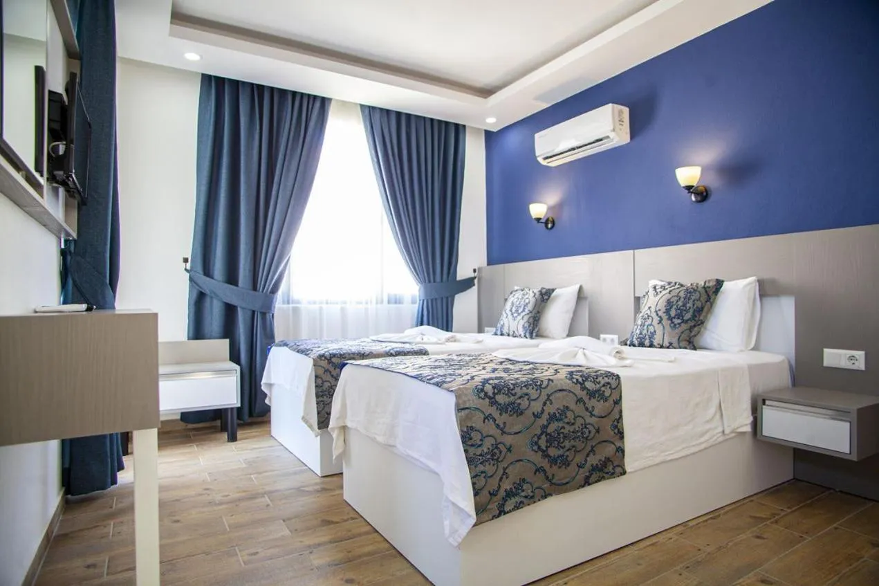 Bed in Demyra Boutique Hotel