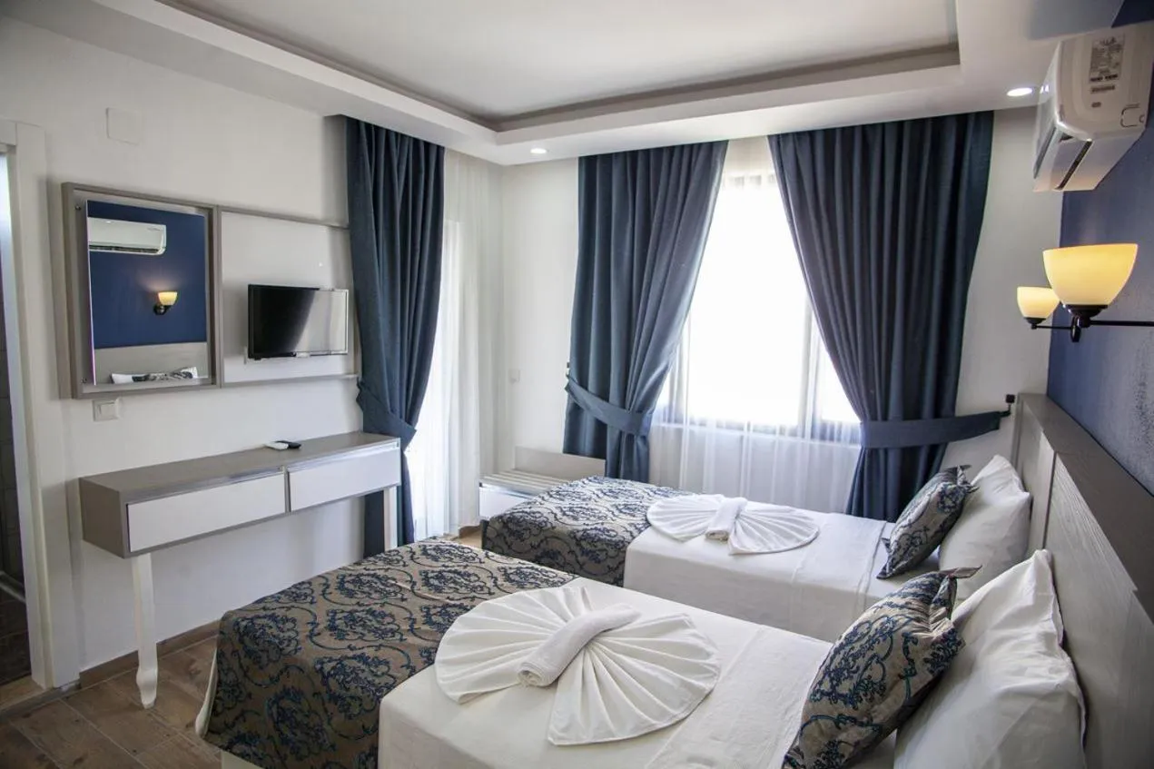 Bed in Demyra Boutique Hotel