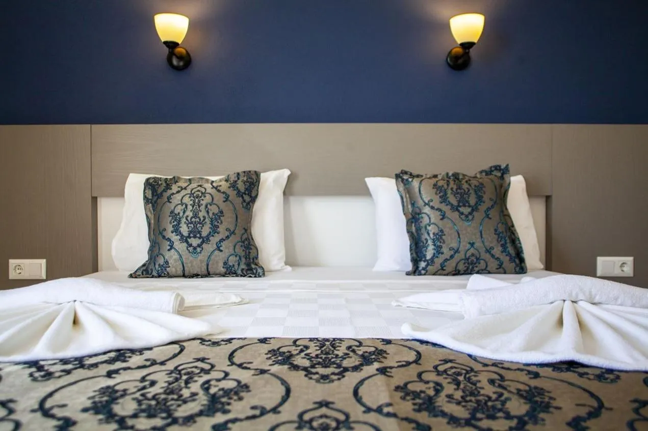 Bed in Demyra Boutique Hotel