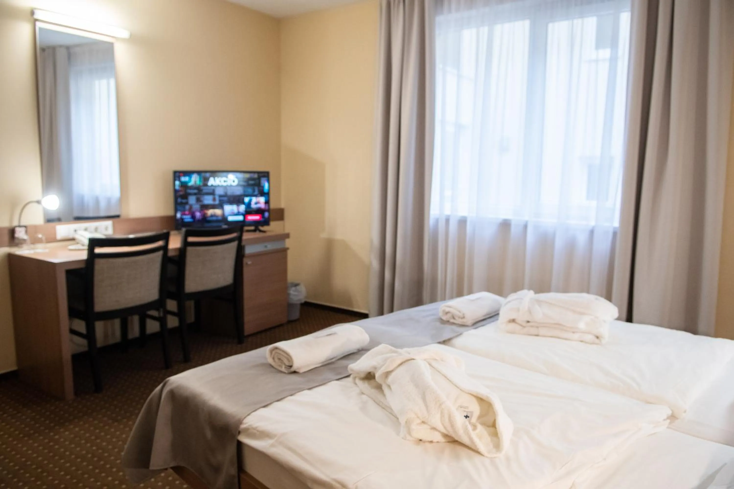 Bed in CE Plaza Hotel