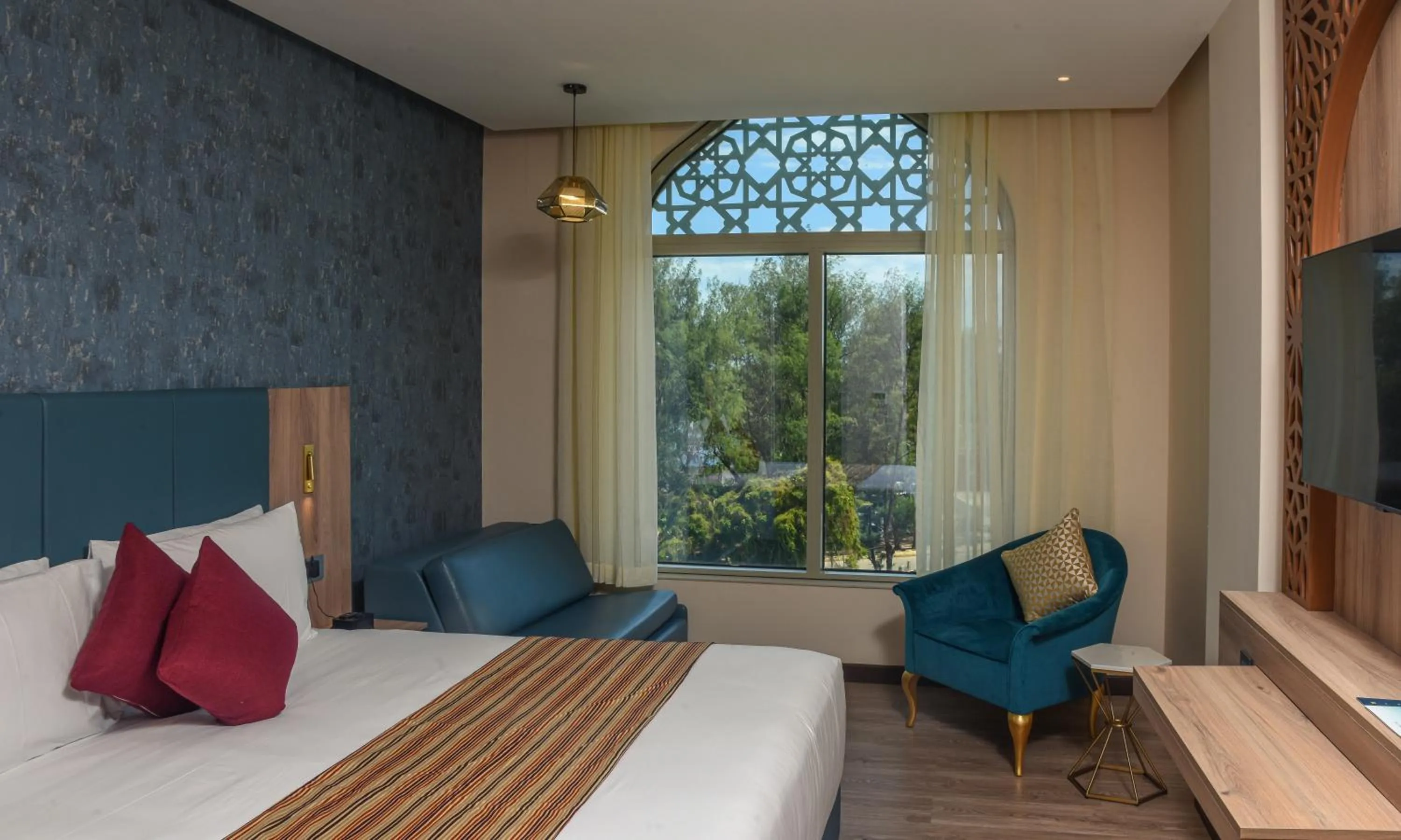 Bedroom, Bed in Golden Tulip Zanzibar Airport Hotel & Spa