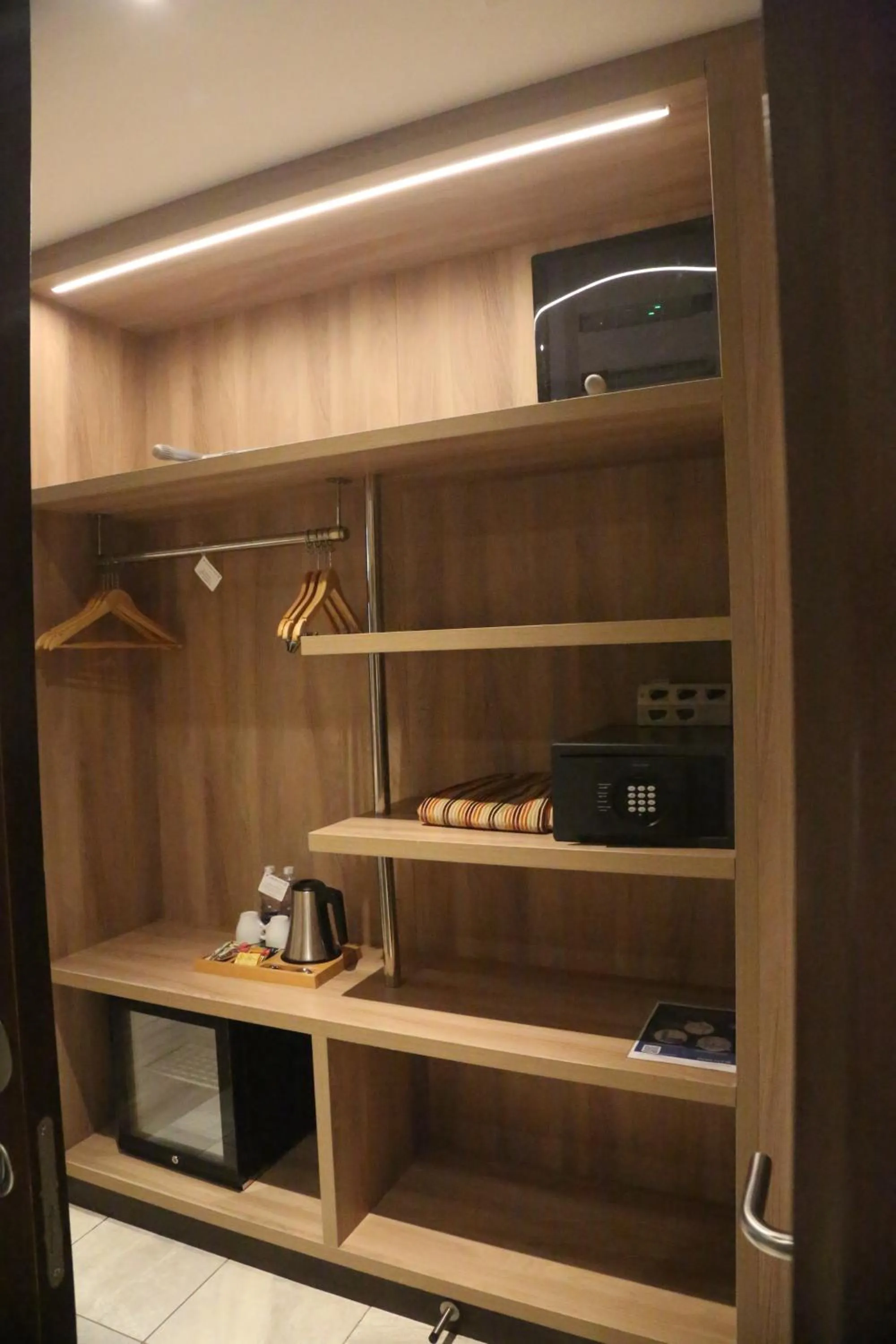 wardrobe in Golden Tulip Zanzibar Airport Hotel & Spa