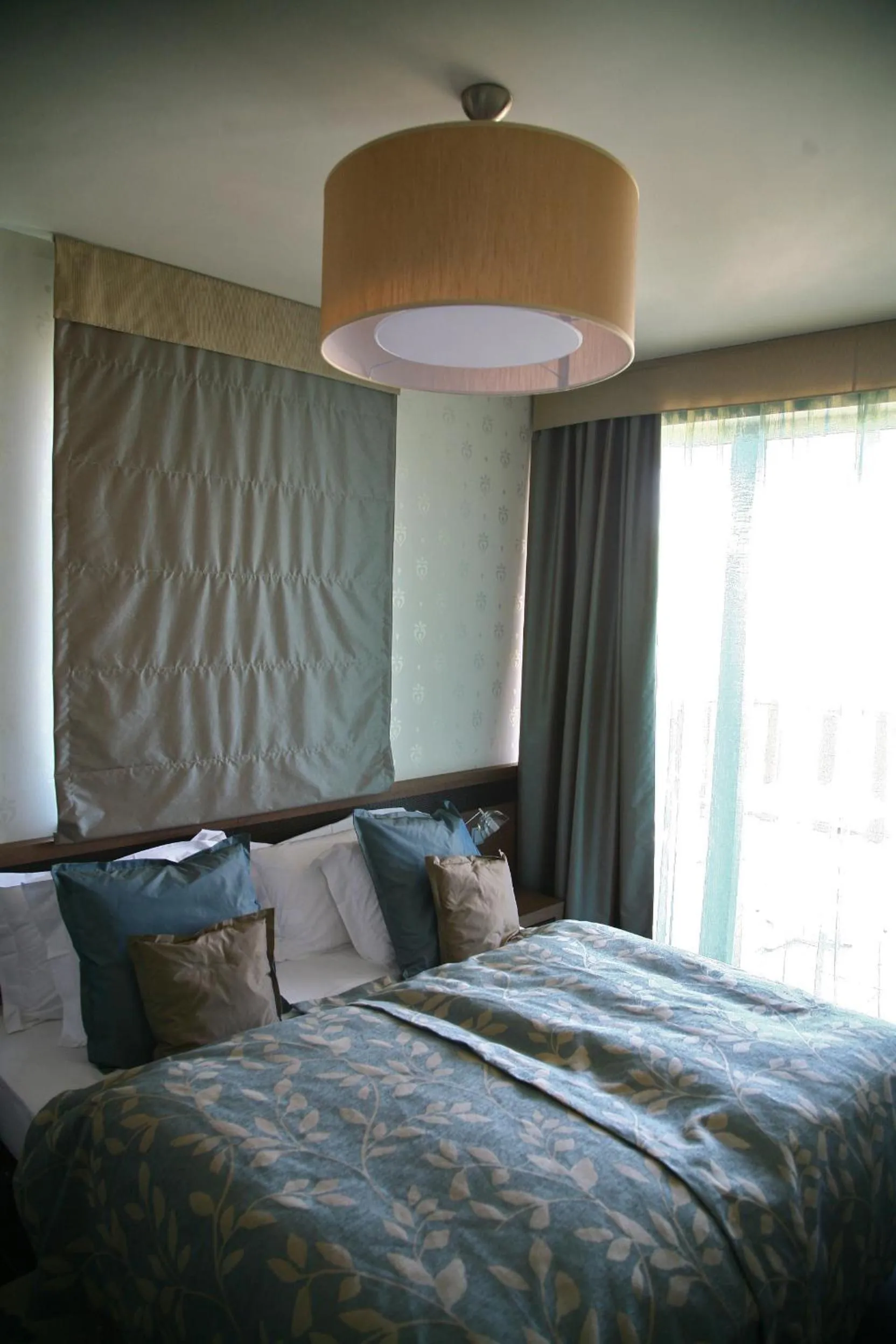 Bed in Echo Residence All Suite Hotel