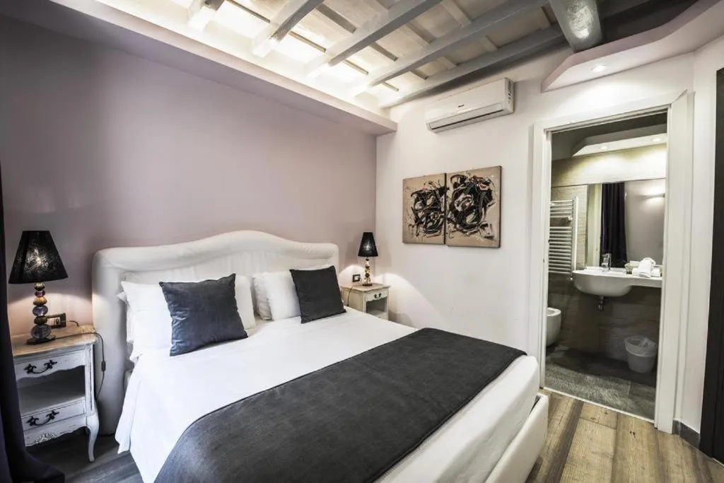 Bed in Corso Suite 107 Rooms Wellness & Spa