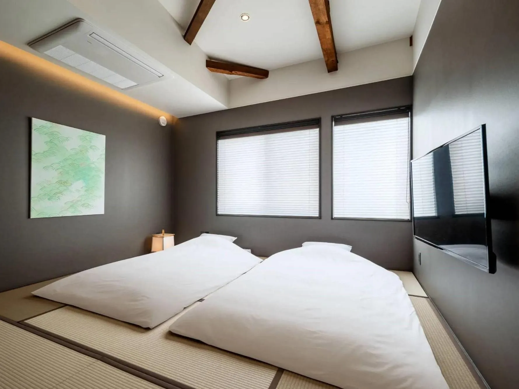 Bed in THE MACHIYA HOTEL TAKAYAMA