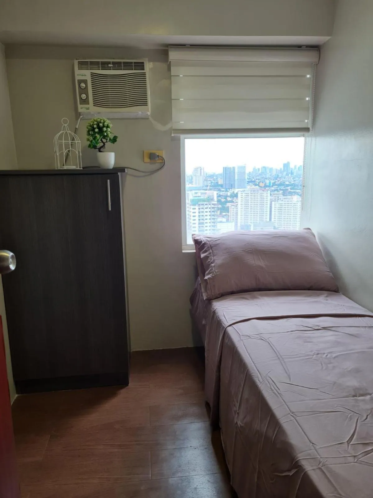 Bed in Gilmore Tower Suites By SMS Hospitality