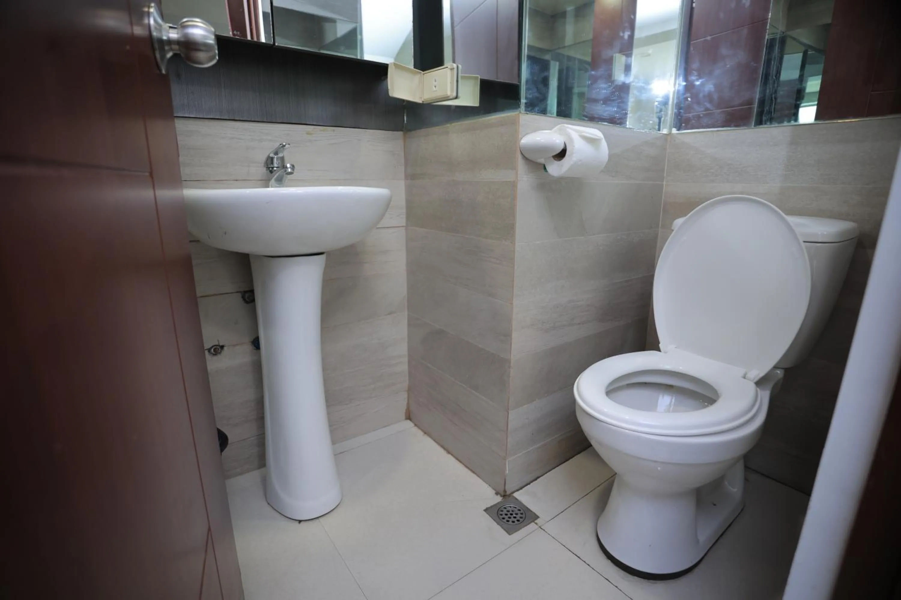 Toilet in Gilmore Tower Suites By SMS Hospitality