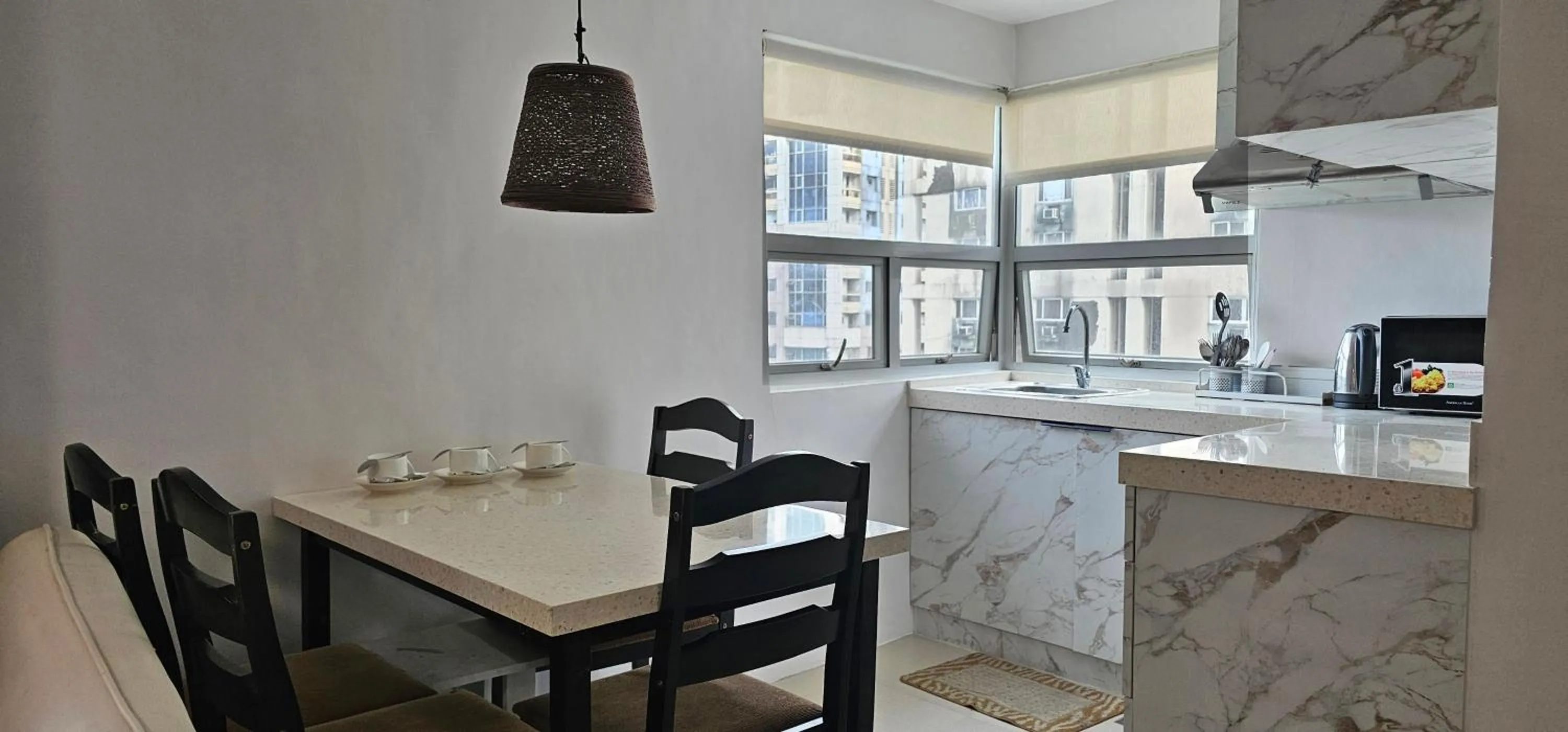 Kitchen or kitchenette in Gilmore Tower Suites By SMS Hospitality