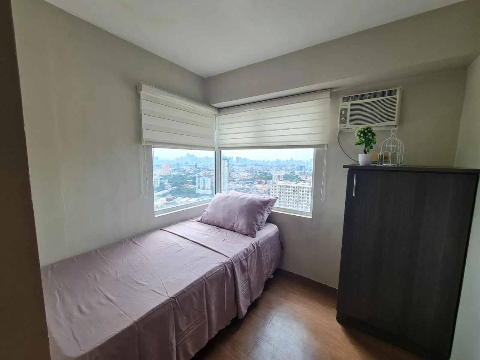 Bed in Gilmore Tower Suites By SMS Hospitality