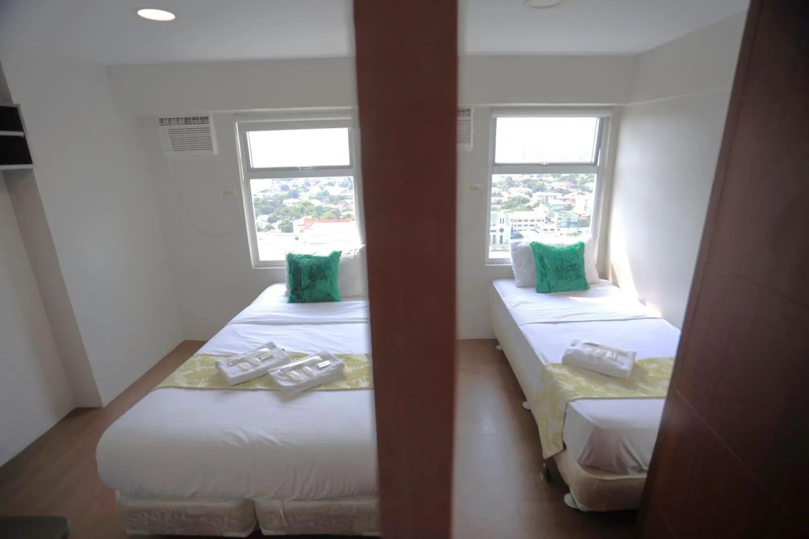 Bed in Gilmore Tower Suites By SMS Hospitality