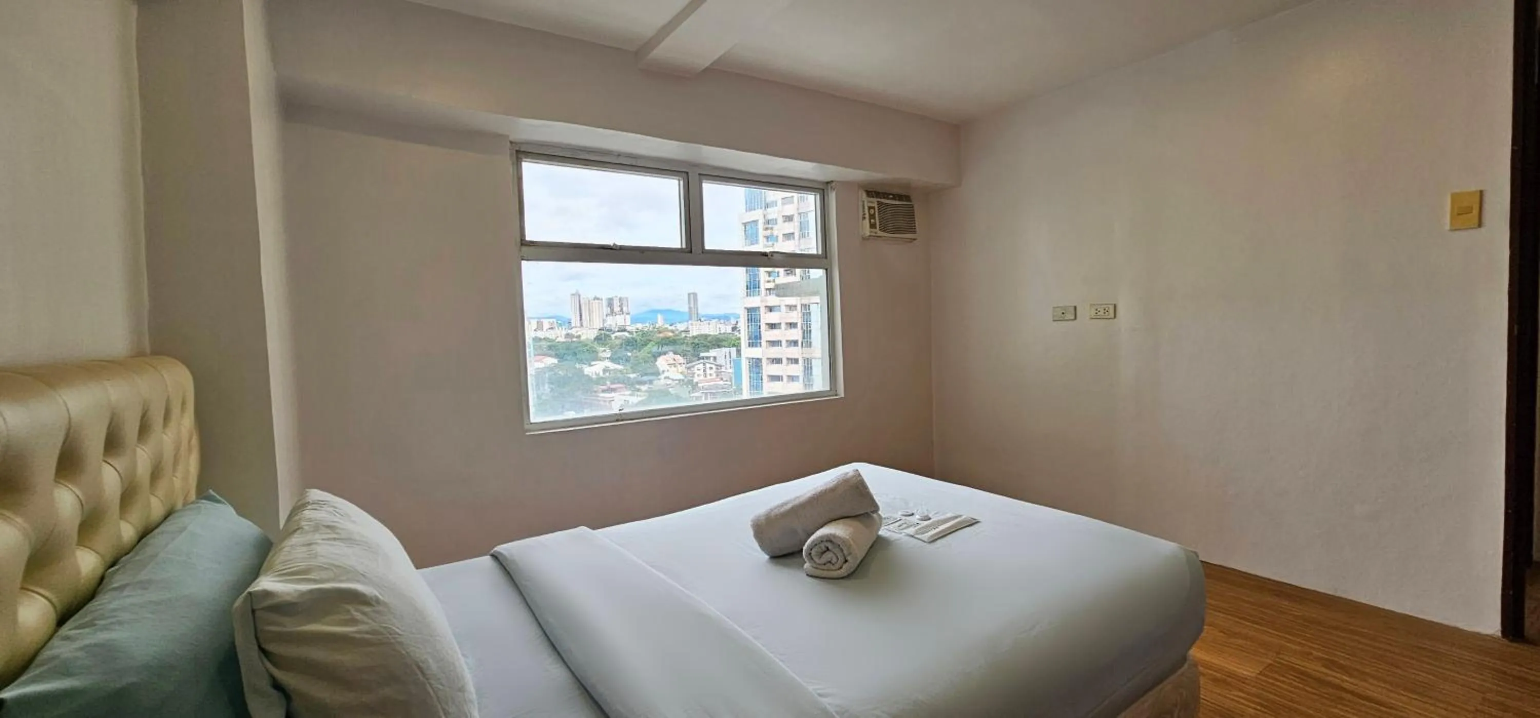 Bed in Gilmore Tower Suites By SMS Hospitality