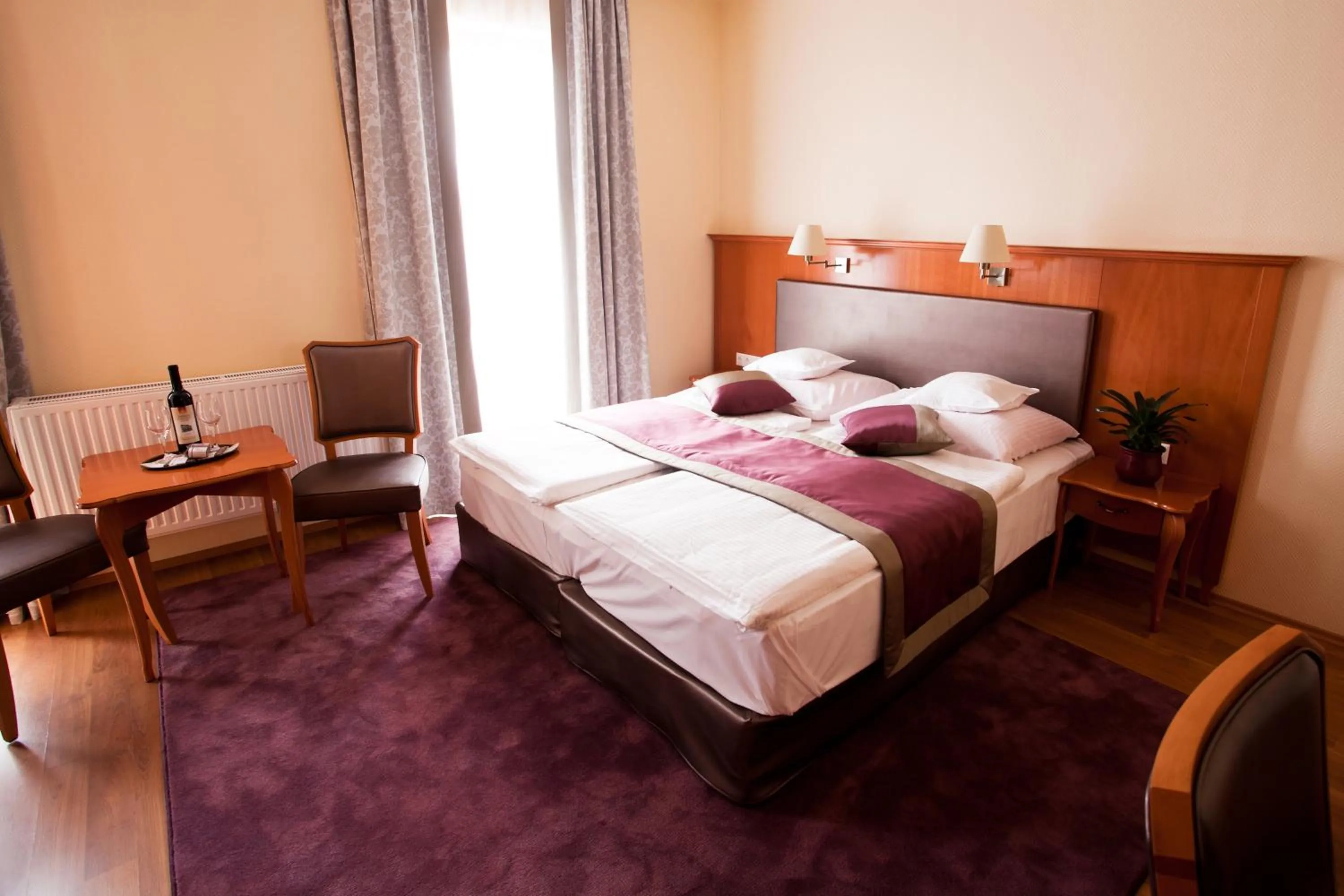 Bed in Pannonia Hotel