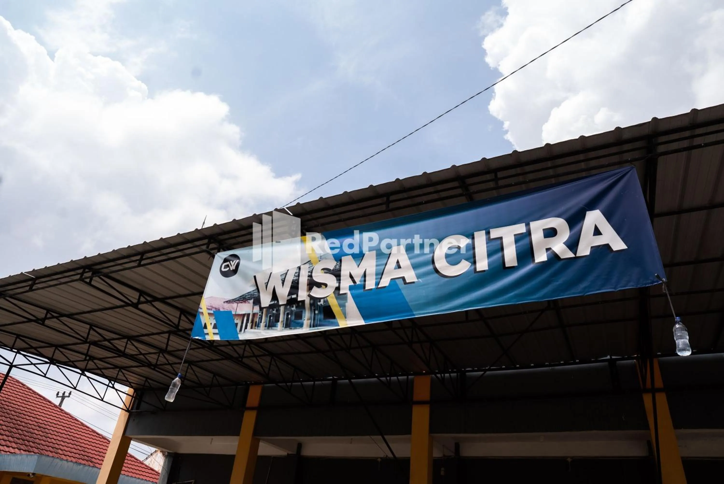 Property logo or sign in Wisma Citra Metro Mitra RedDoorz