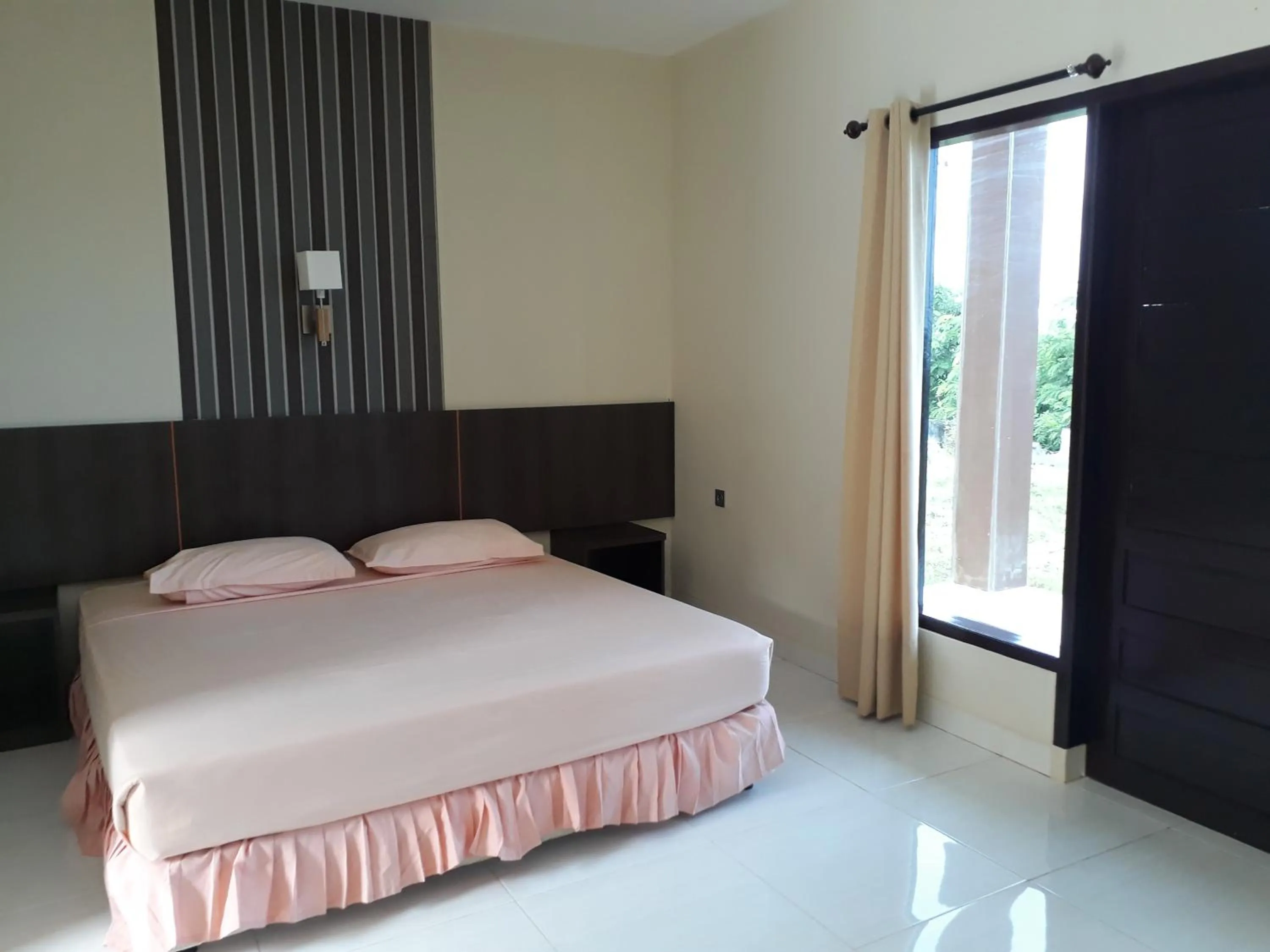 Bed in Bukit Kenari Hotel & Restaurant