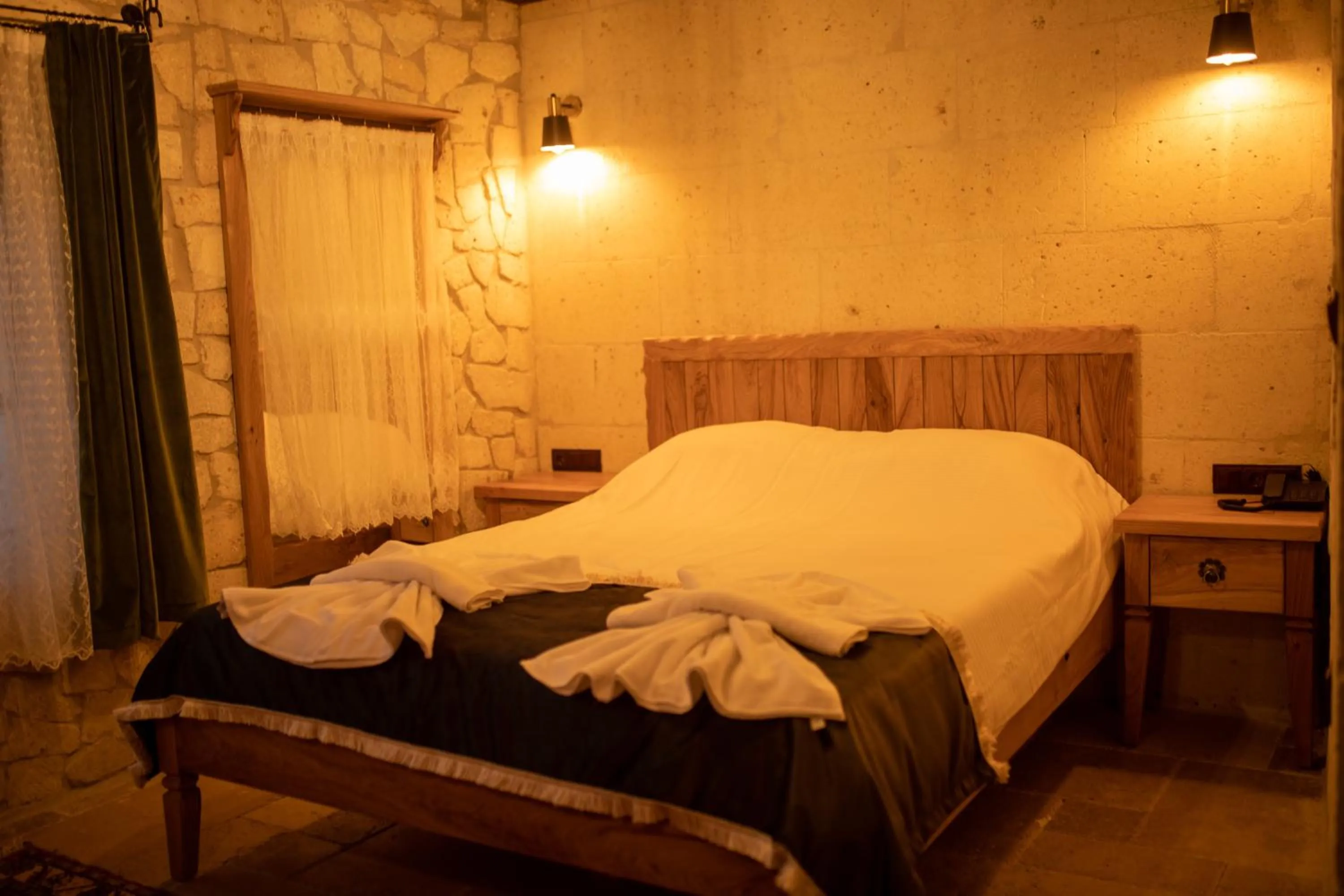 Bed in Pome Granate Cave Hotel