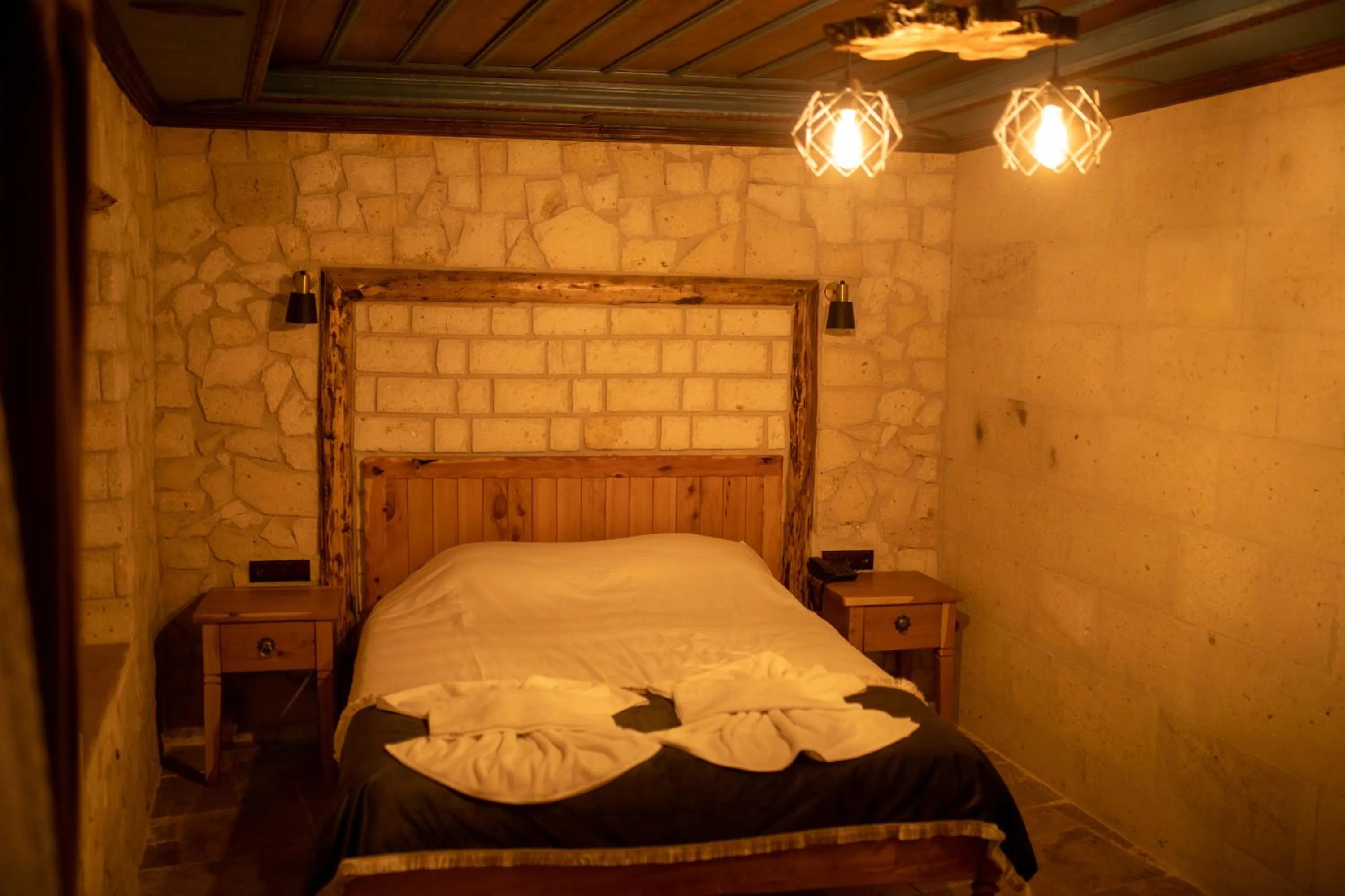 Bed in Pome Granate Cave Hotel
