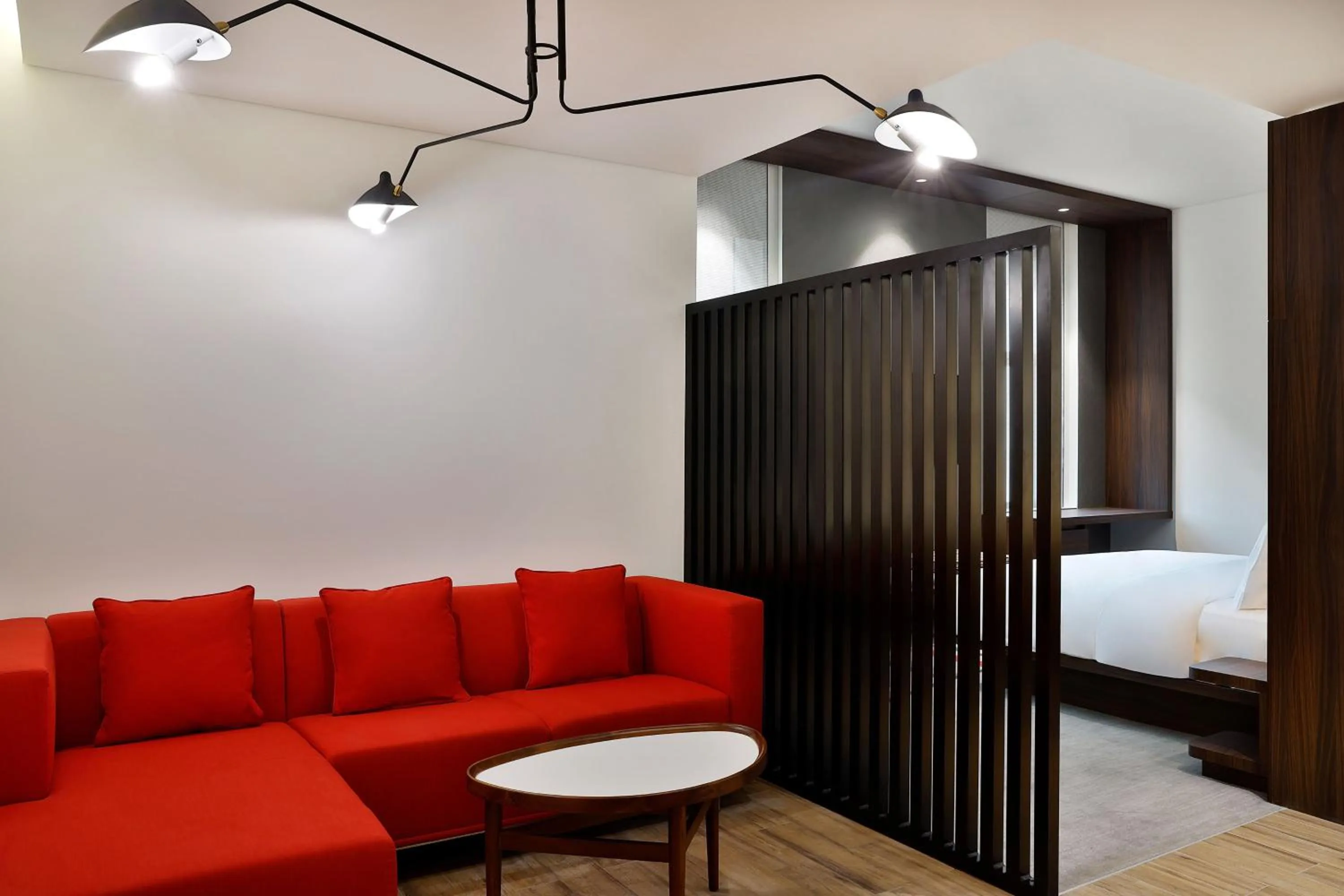 Living room, Bed in Aloft Dubai Airport