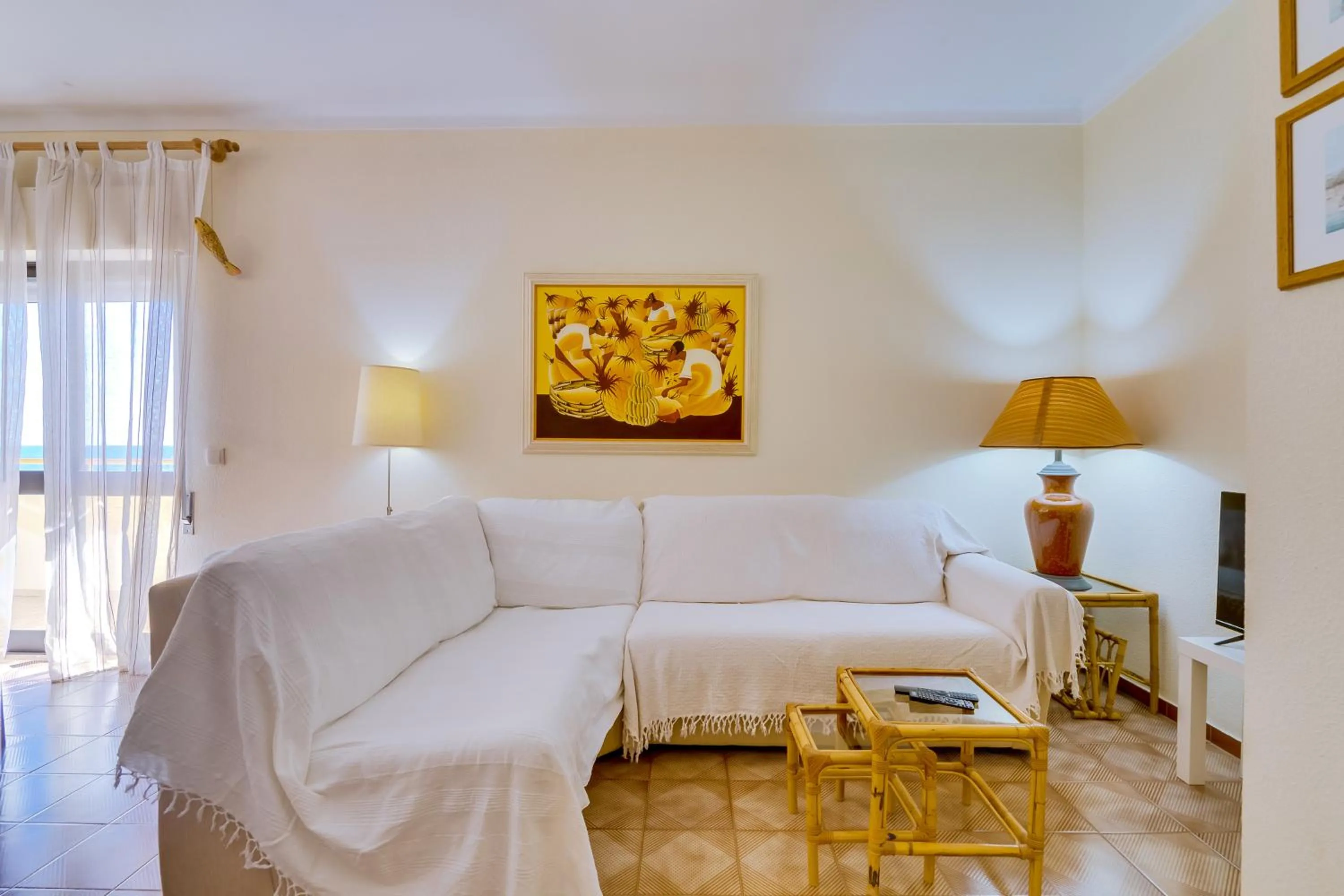Living room in InfiniteSeaView - Quarteira at Homesbyfc