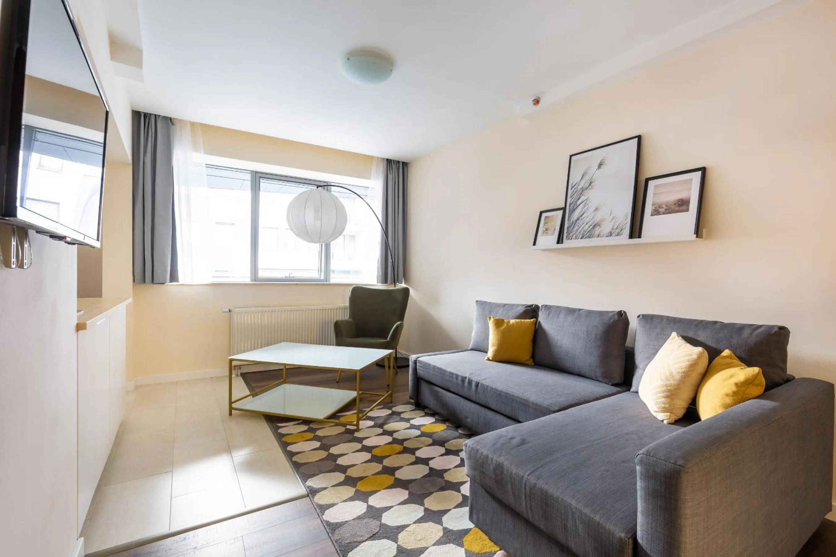 Living room in Central Passage Apartments by Vagabond Downtown