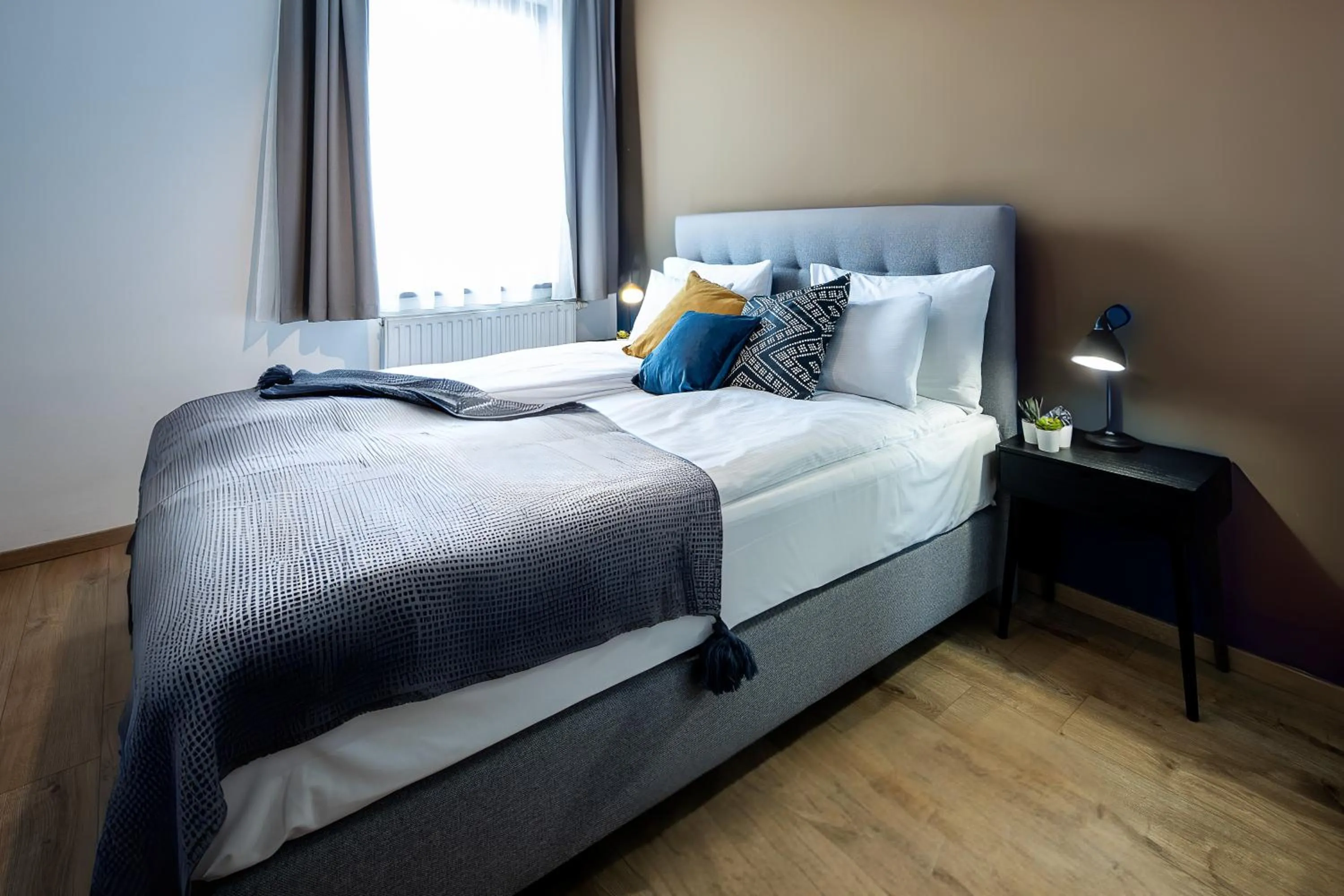 Bedroom, Bed in Central Passage Apartments by Vagabond Downtown