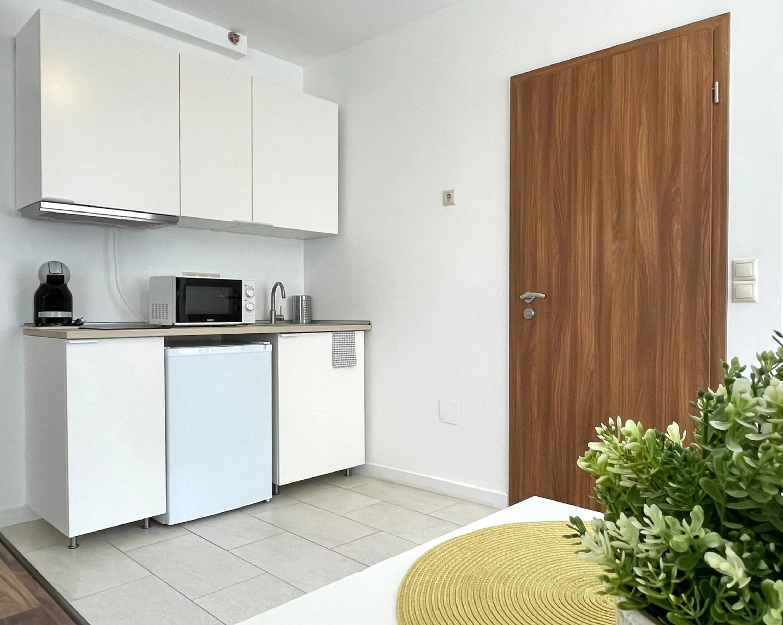 kitchen in Central Passage Apartments by Vagabond Downtown