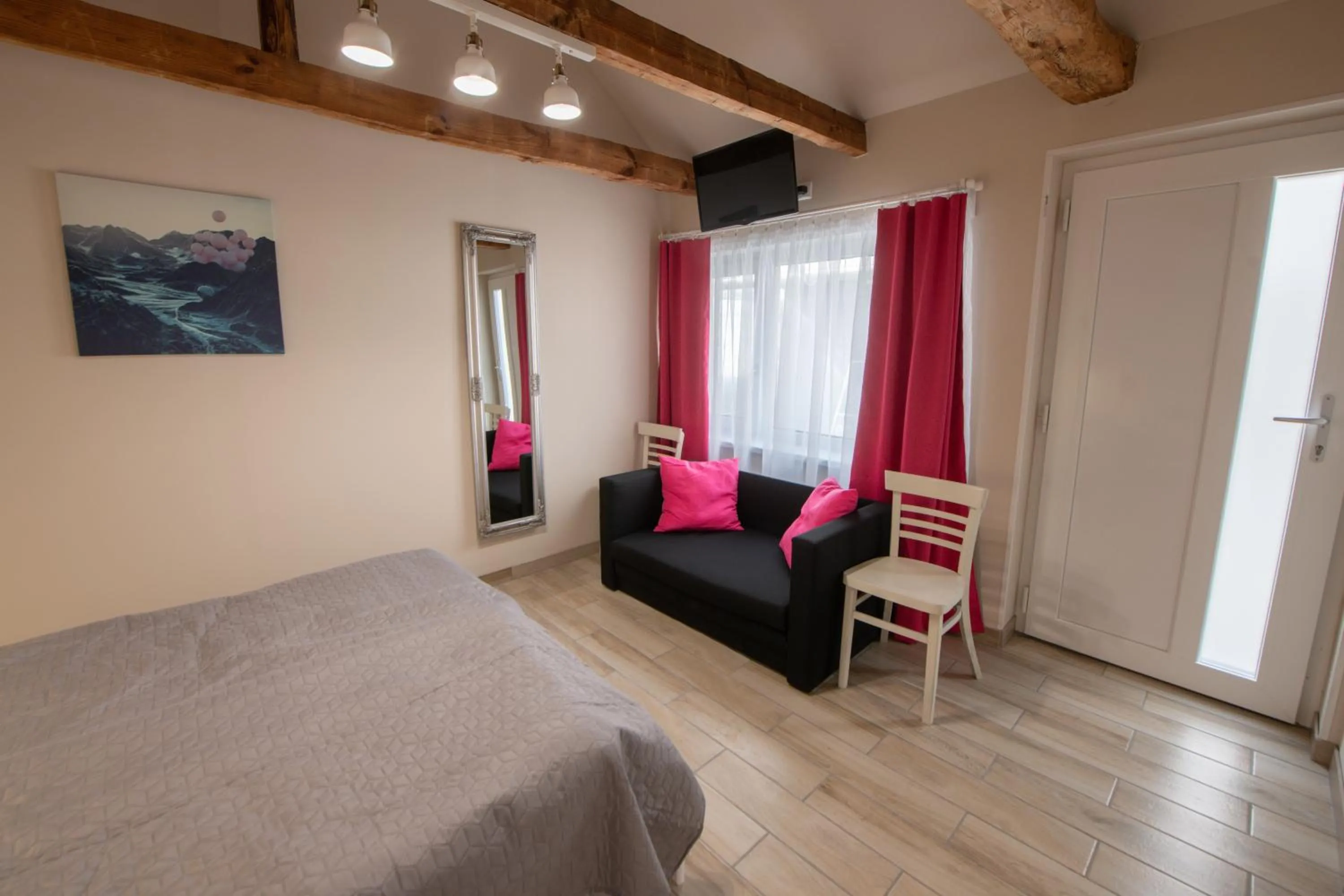 Seating area, Bed in Caesar Apartments & Rooms